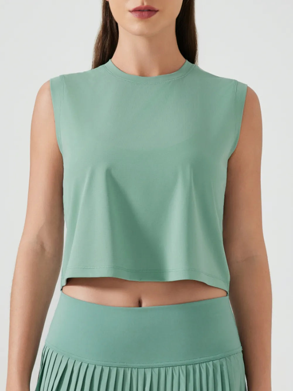 Millennia cropped active tank, sleeveless with round neck, teal green (front view).