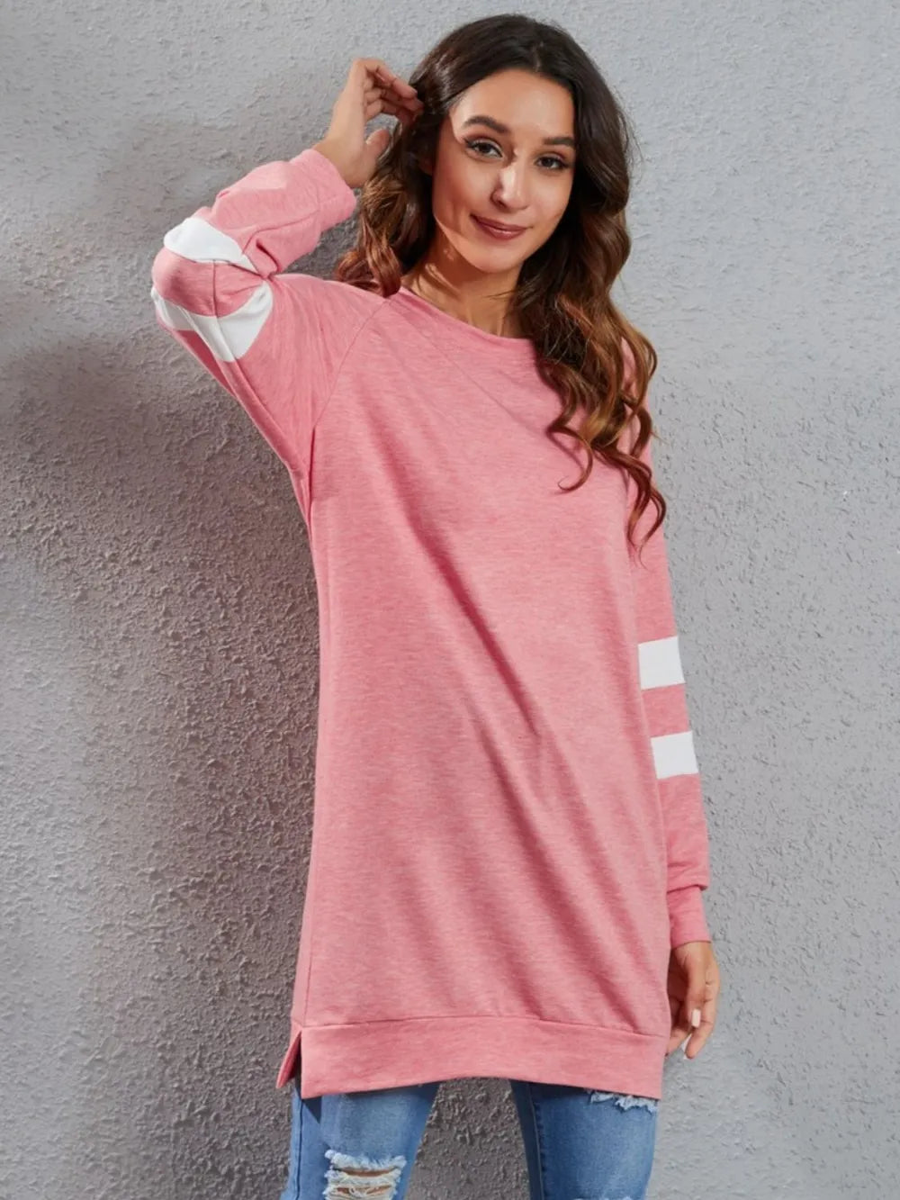 Pink long-sleeve t-shirt with round neck and white stripe at sleeve hem