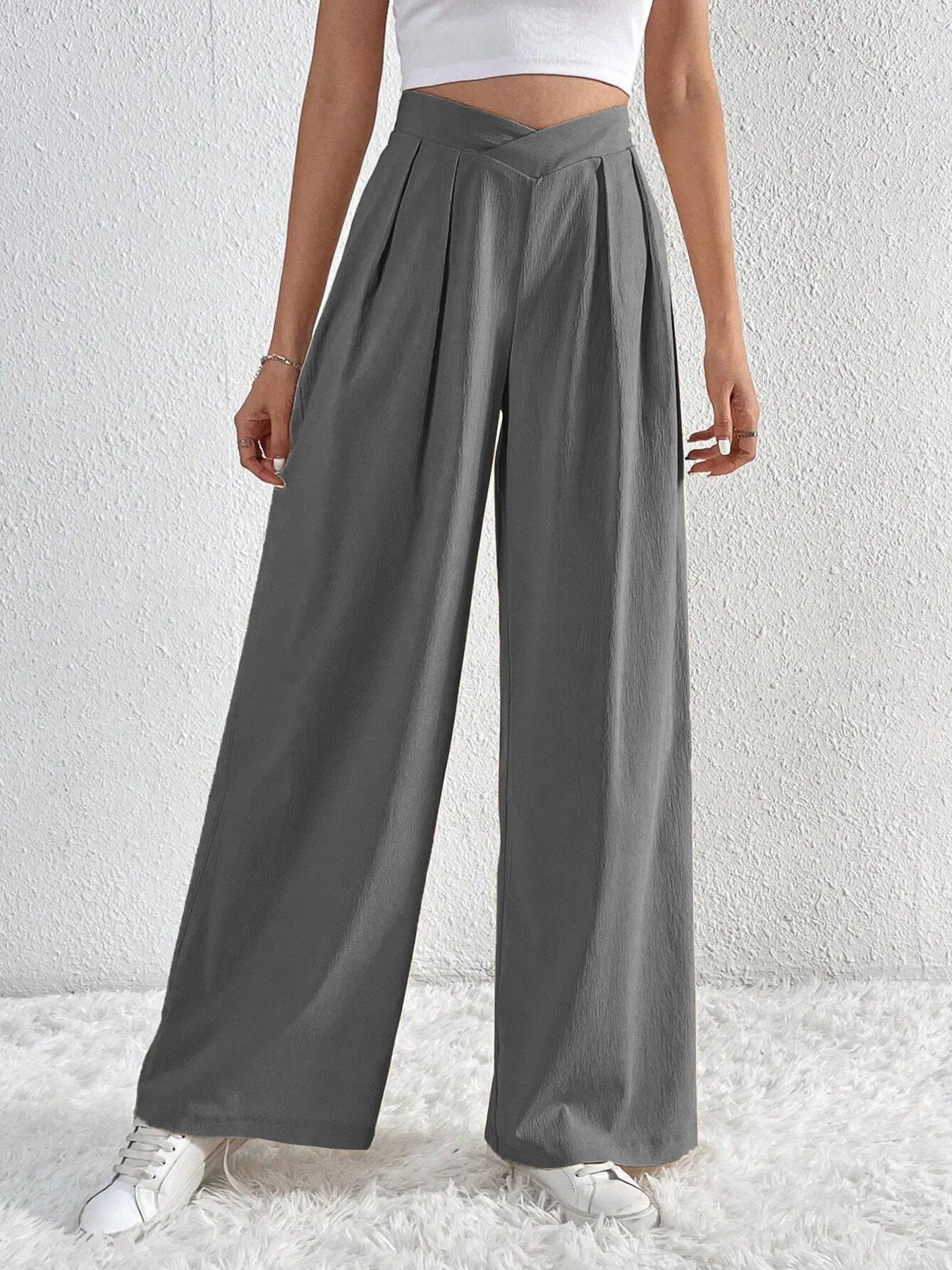 Dark gray wide-leg pants with ruched V-waist and roomy wide legs