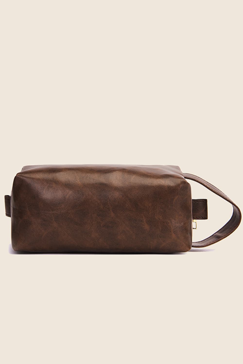 Dark brown vegan leather makeup bag with side strap and top zipper