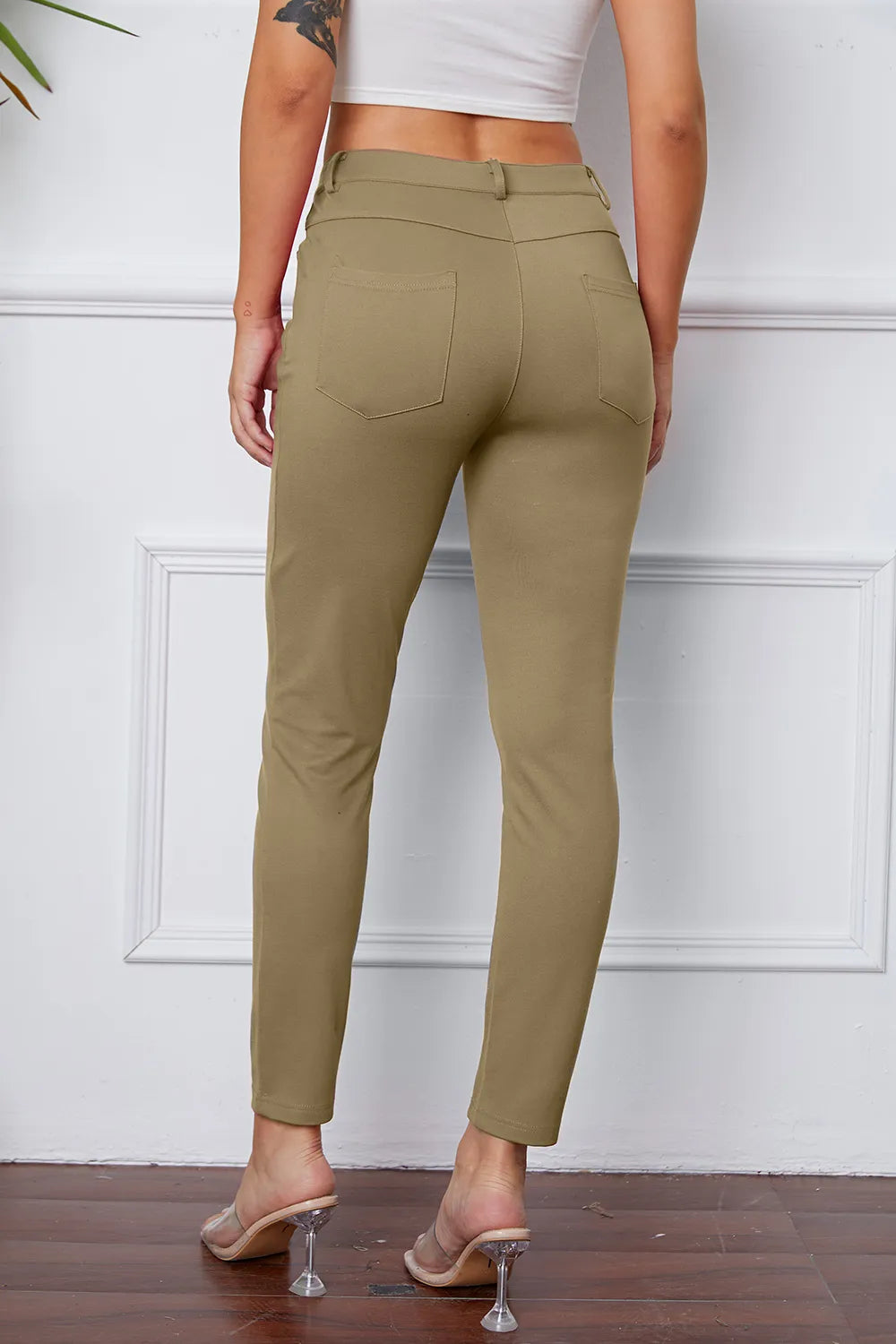 Women's khaki stretch pants with belt loops, front pockets, and ankle length