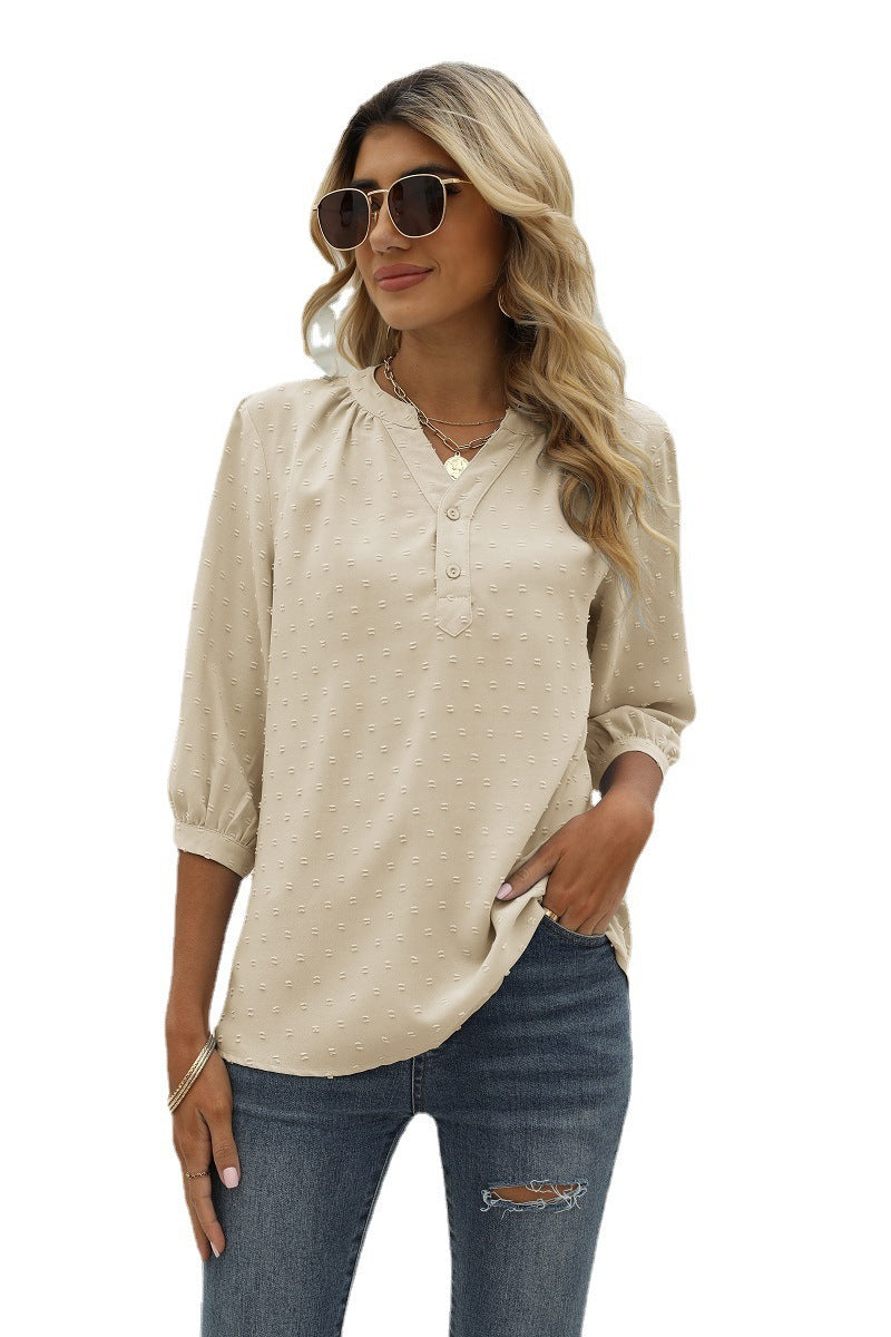 Cream swiss dot notched-neck blouse with 3/4 sleeves and button placket