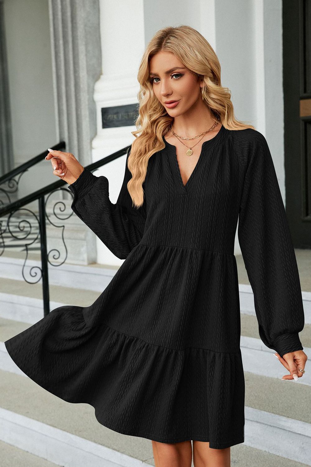 Black notched neck long sleeve mini dress with flared tiered skirt