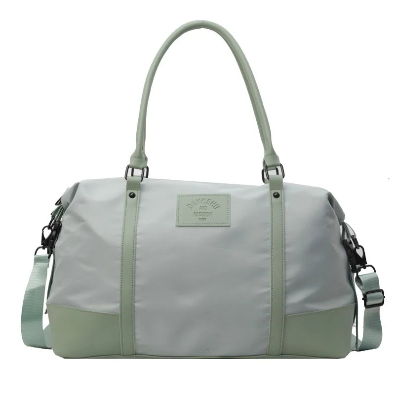 Light green polyester travel duffel bag with detachable crossbody strap and top handles
