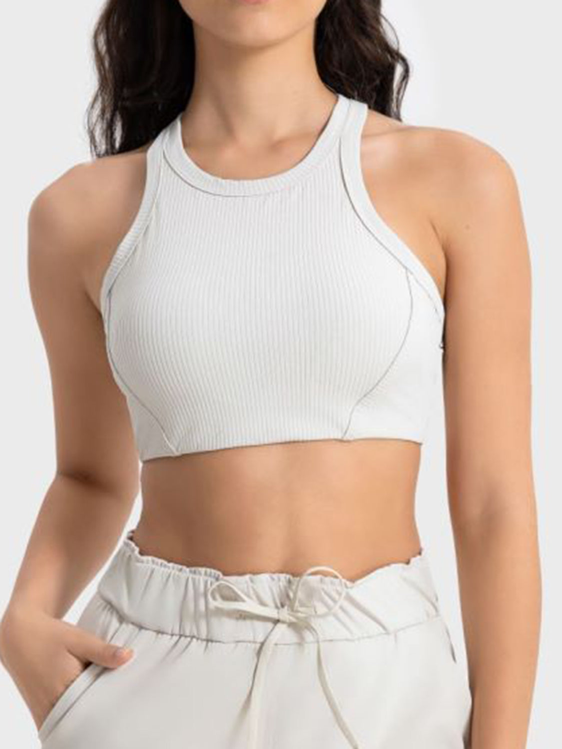 White cropped sport tank with wide straps and curved seam details
