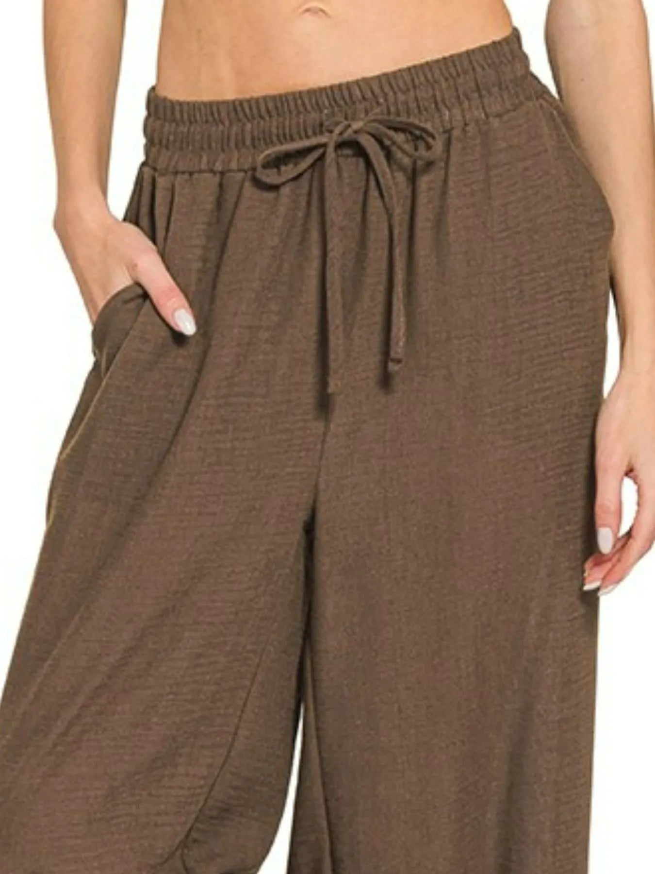 Brown woven crepe drawstring waistband pants with elastic waist and wide legs