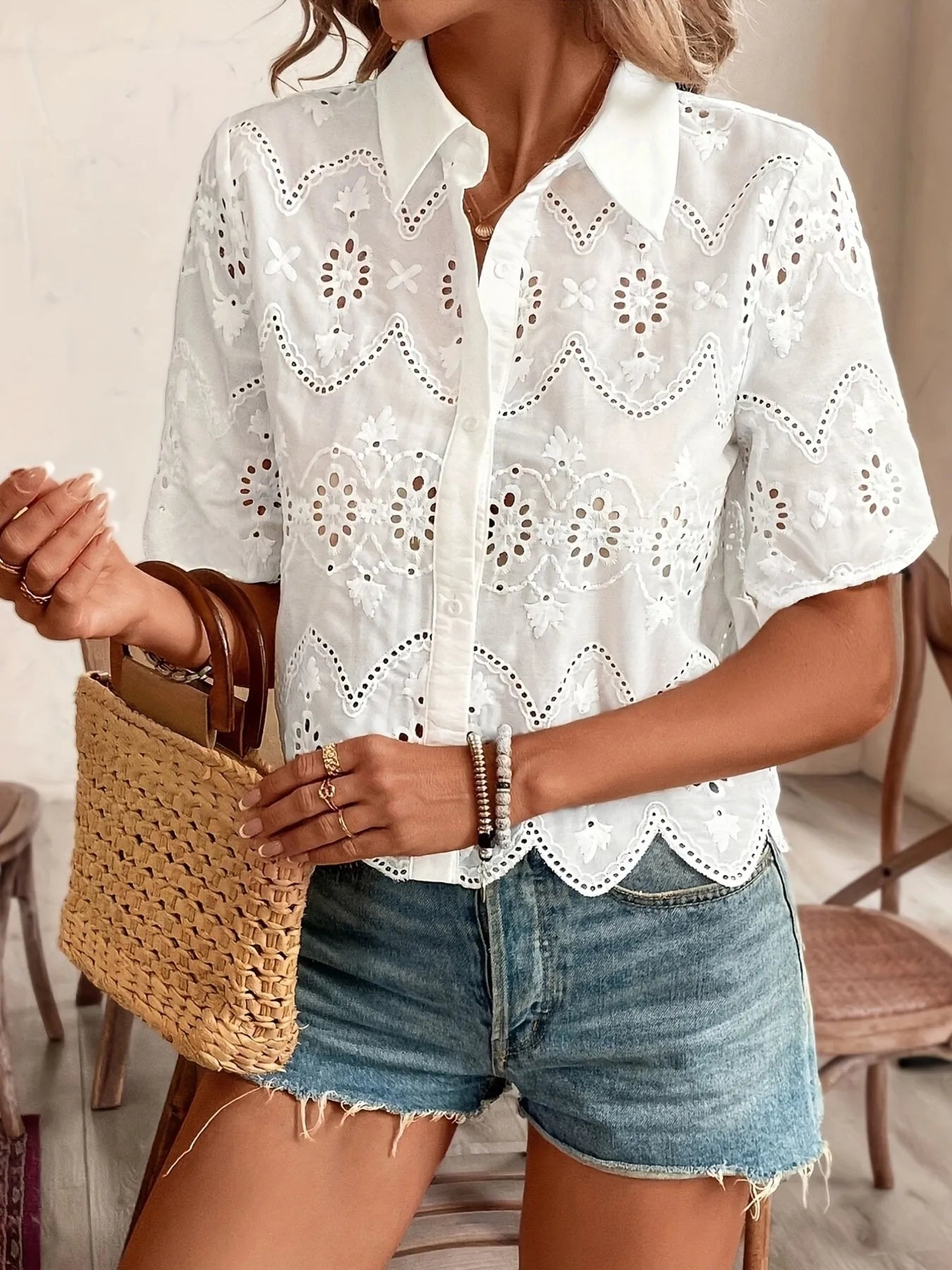 White eyelet lace short-sleeve button-up shirt showing embroidered eyelet details