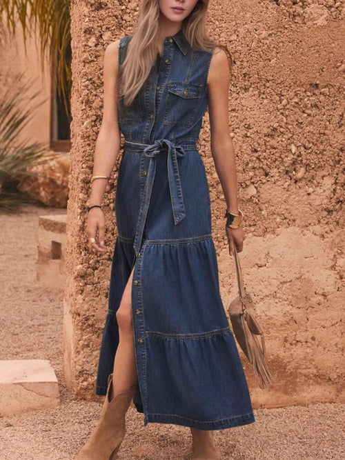Dark blue sleeveless denim dress with button front and tied waist, tiered hem