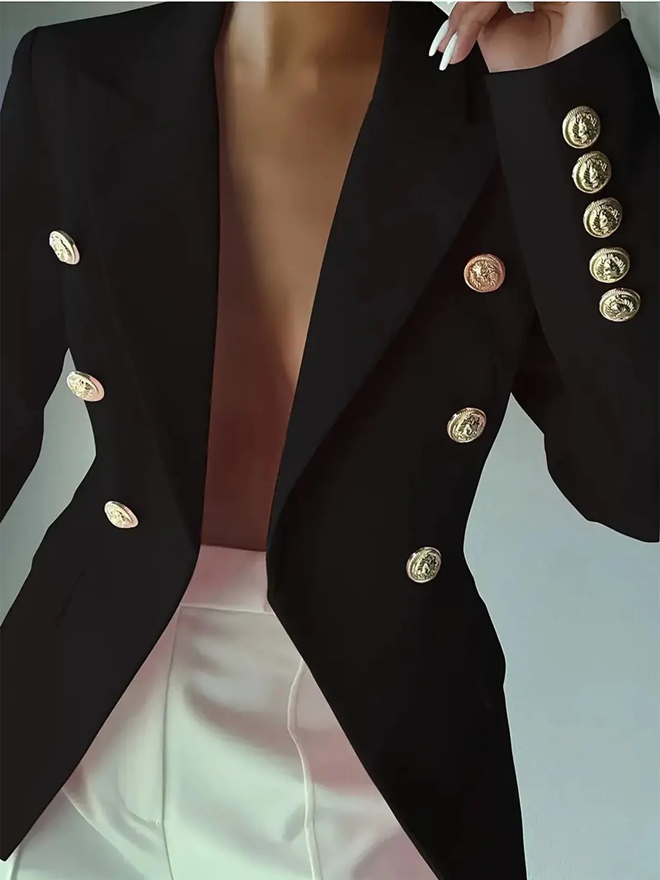 Black lapel blazer with gold-tone decorative buttons across the front and cuffs