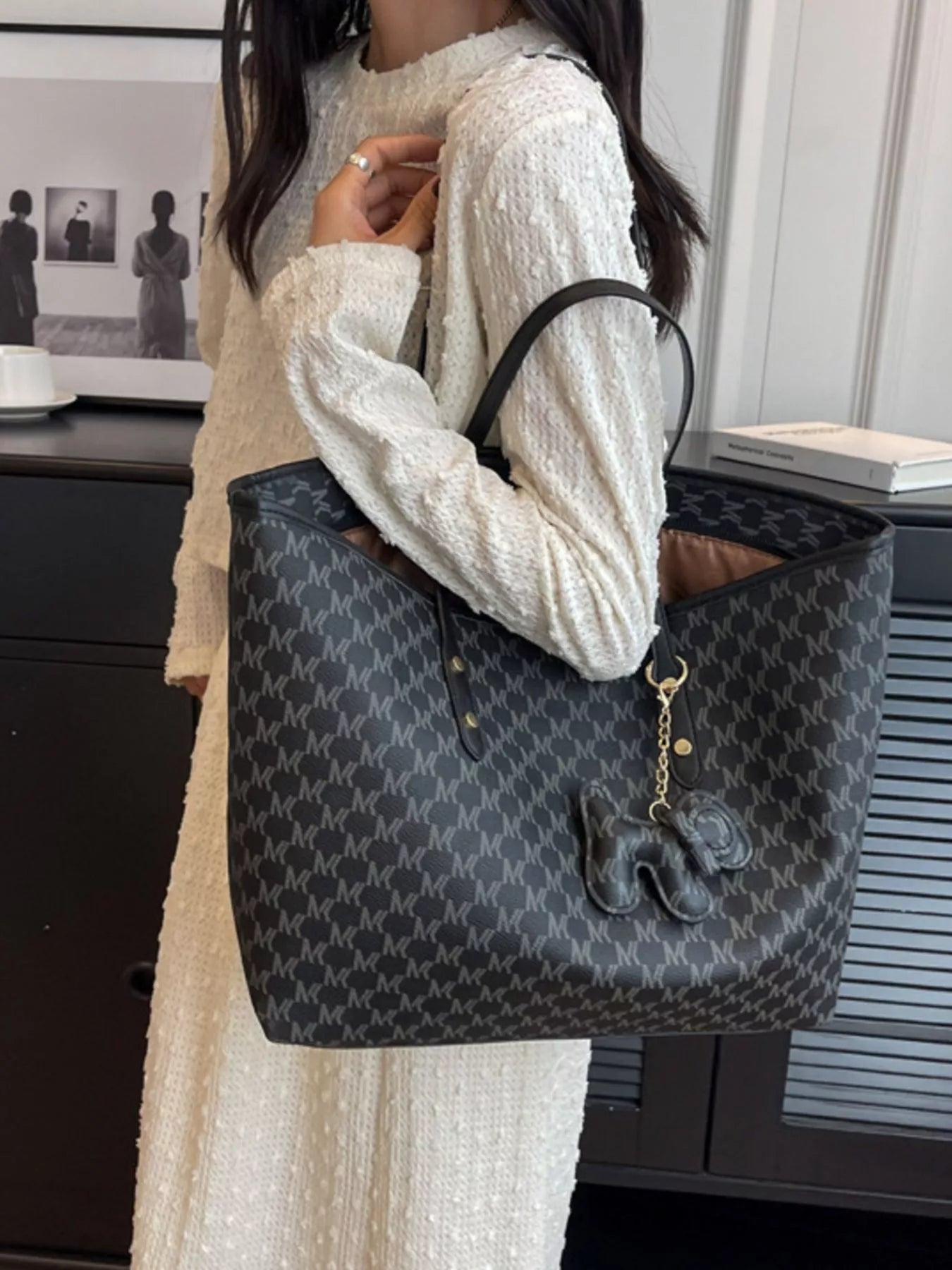 Medium shoulder tote bag in dark monogram vegan leather, top handles, charm tassel