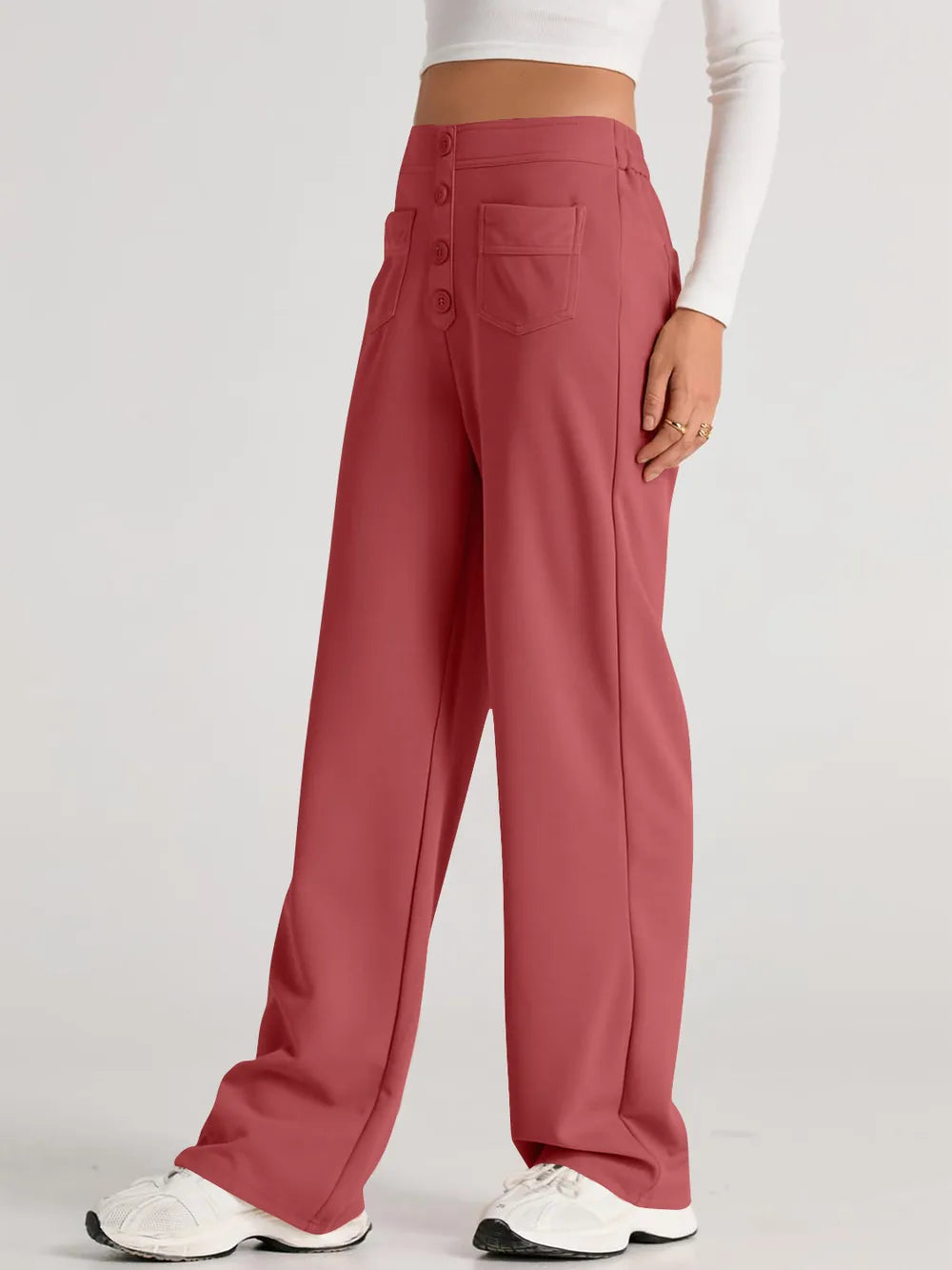 Orange-red high-waist wide-leg pants with button-front and large front pockets