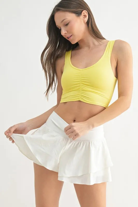 Lemon ruched-front active tank with scoop neckline and sleeveless cut