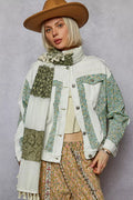 Off-white patchwork denim jacket with green floral panels, button front, chest pockets