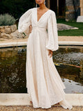 Cedar & Moore V-Neck Long Sleeve Maxi Dress in ivory with tied waist, zipper, and billowy sleeves.