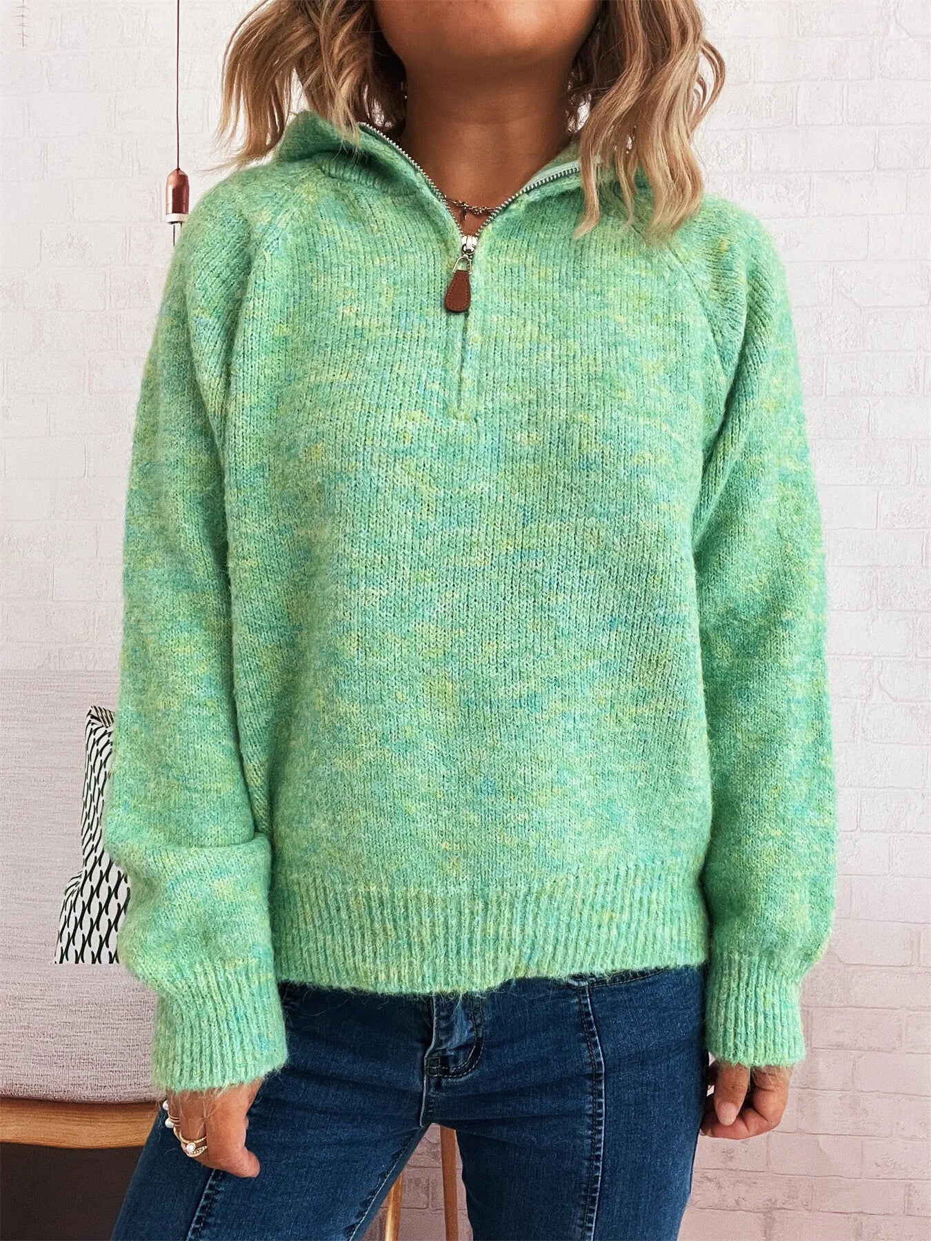 Green quarter-zip sweater with ribbed hem and cuffs, long sleeves