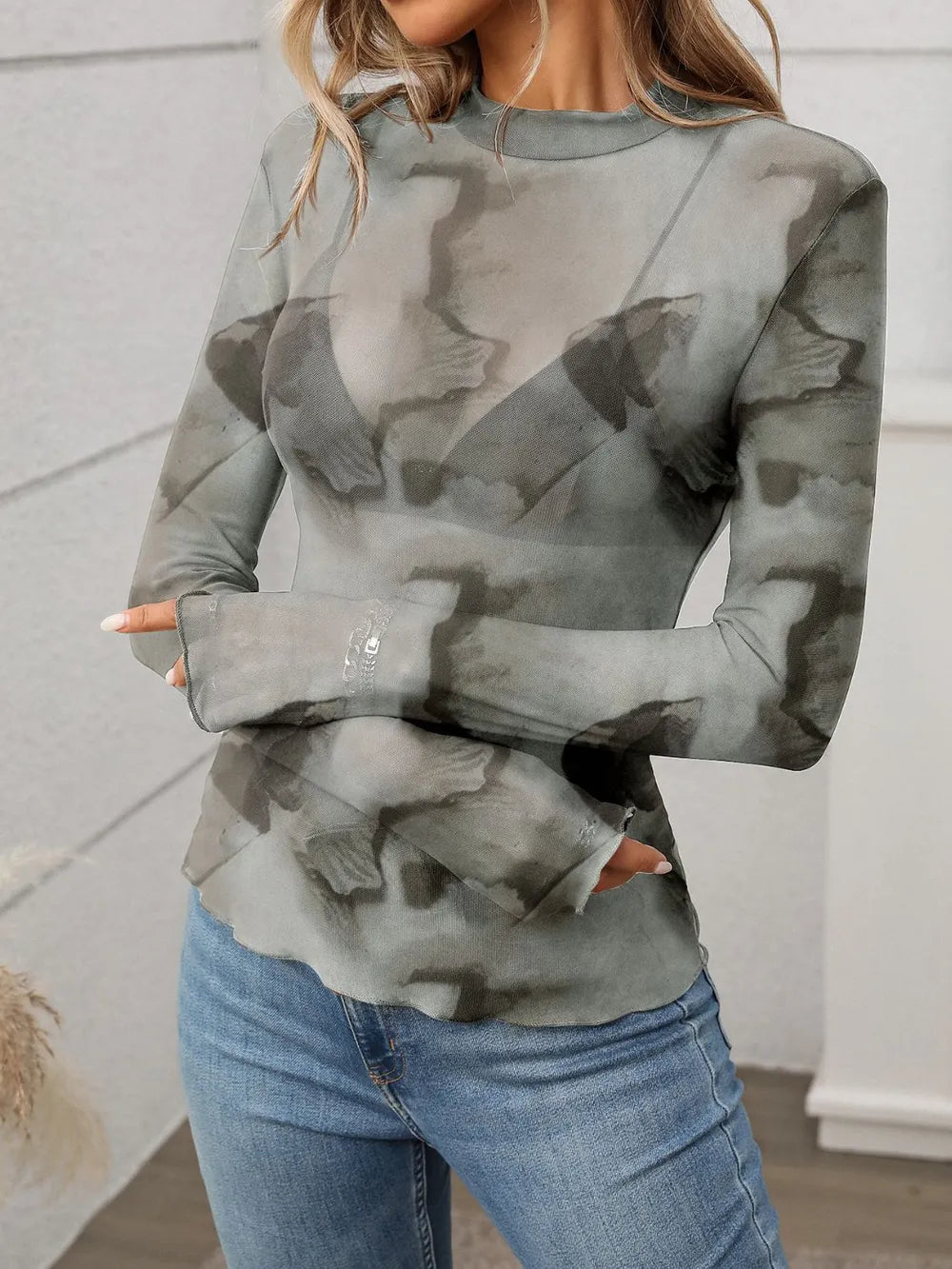Printed mock neck long sleeve mesh T-shirt with ink-style abstract pattern, fitted.
