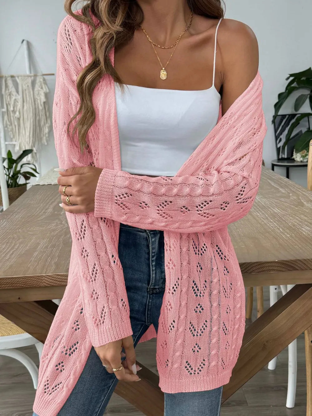Pink open-front long-sleeve cardigan with lace openwork knit and relaxed open front.