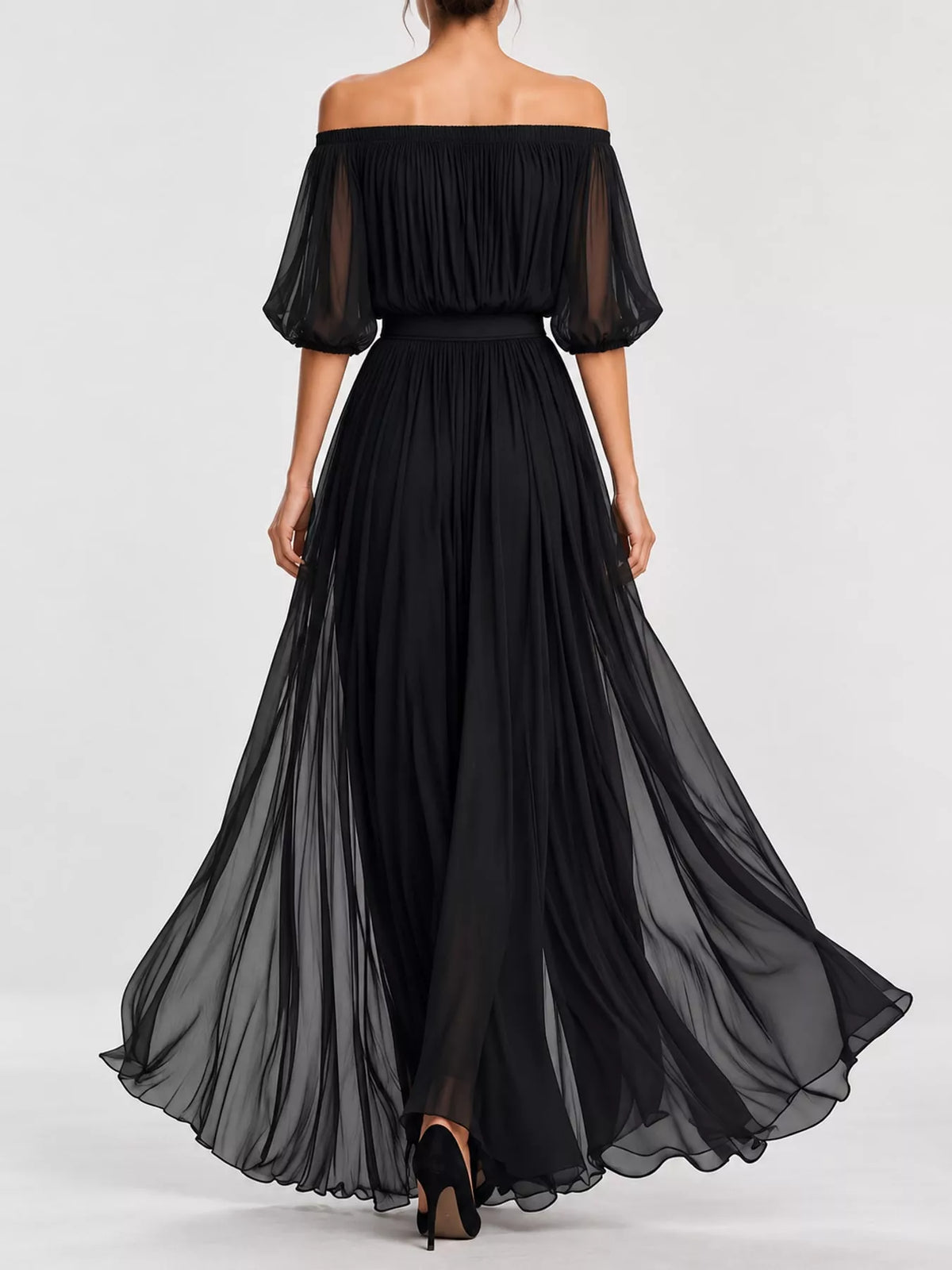 Black off-shoulder chiffon maxi dress from back view with ruched waist and full skirt