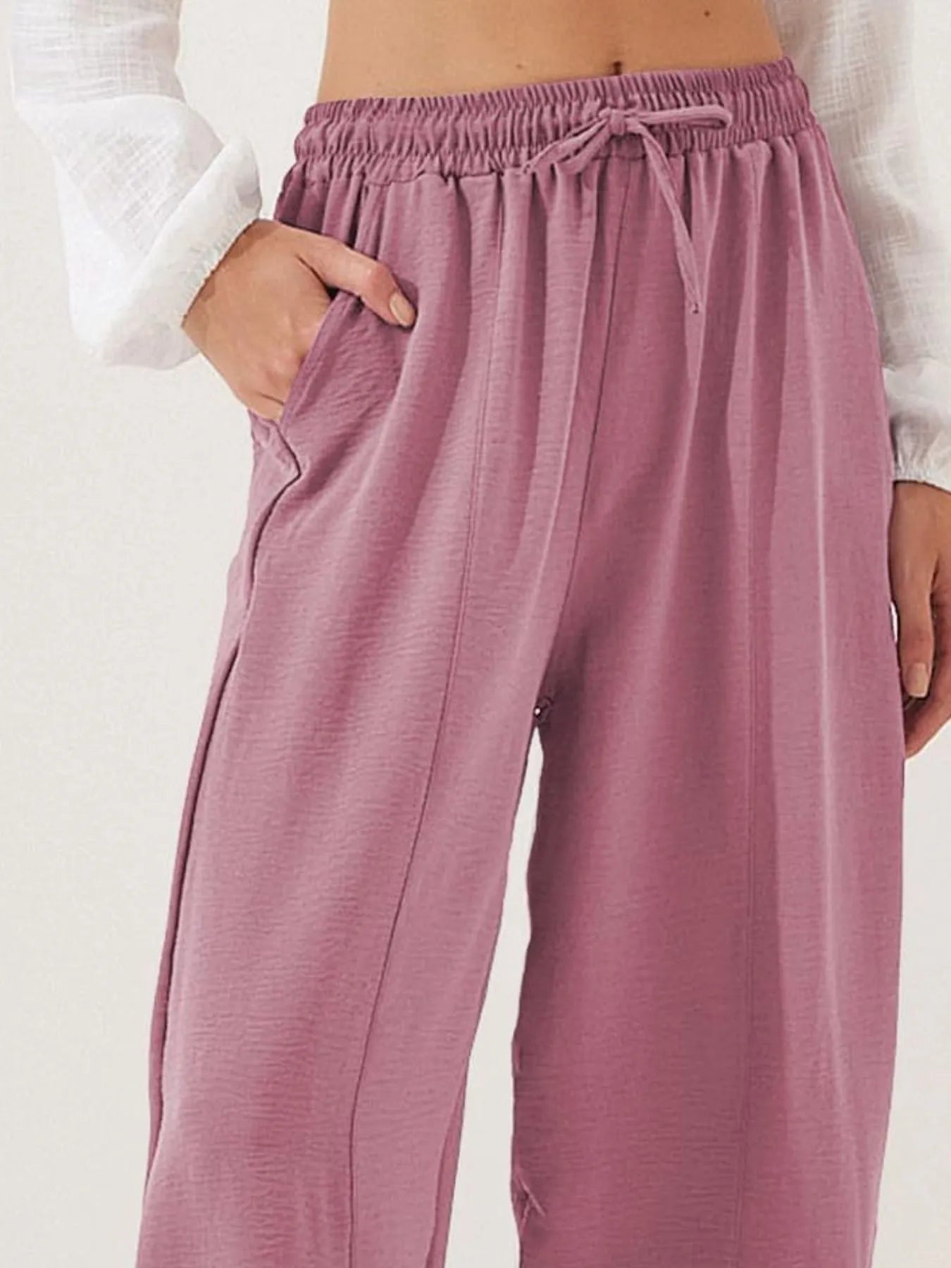 Mauve drawstring wide-leg cropped pants with elastic waist and visible tie