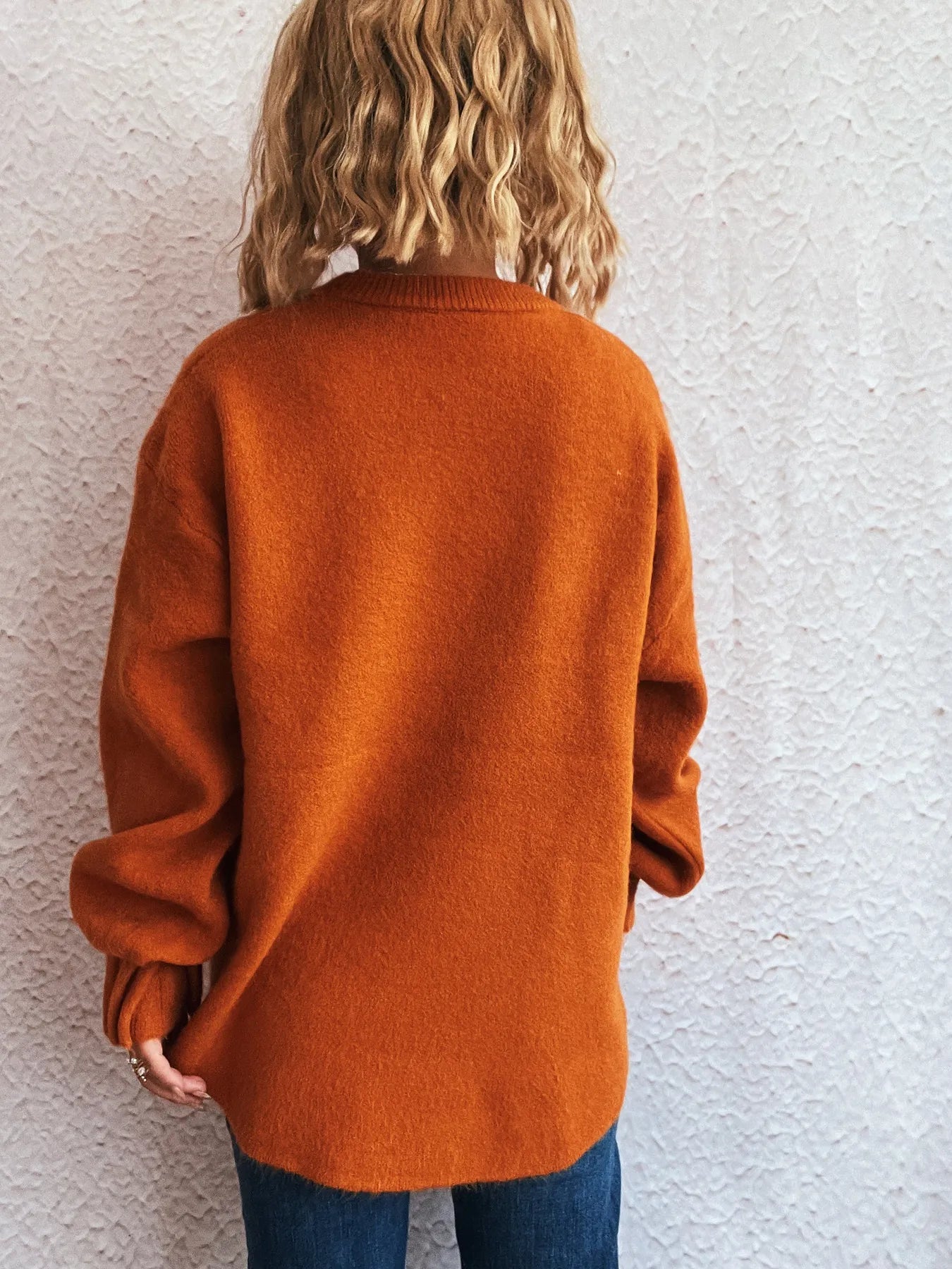 Dropped-shoulder sweater, rust orange, back view, round neckline, long sleeves