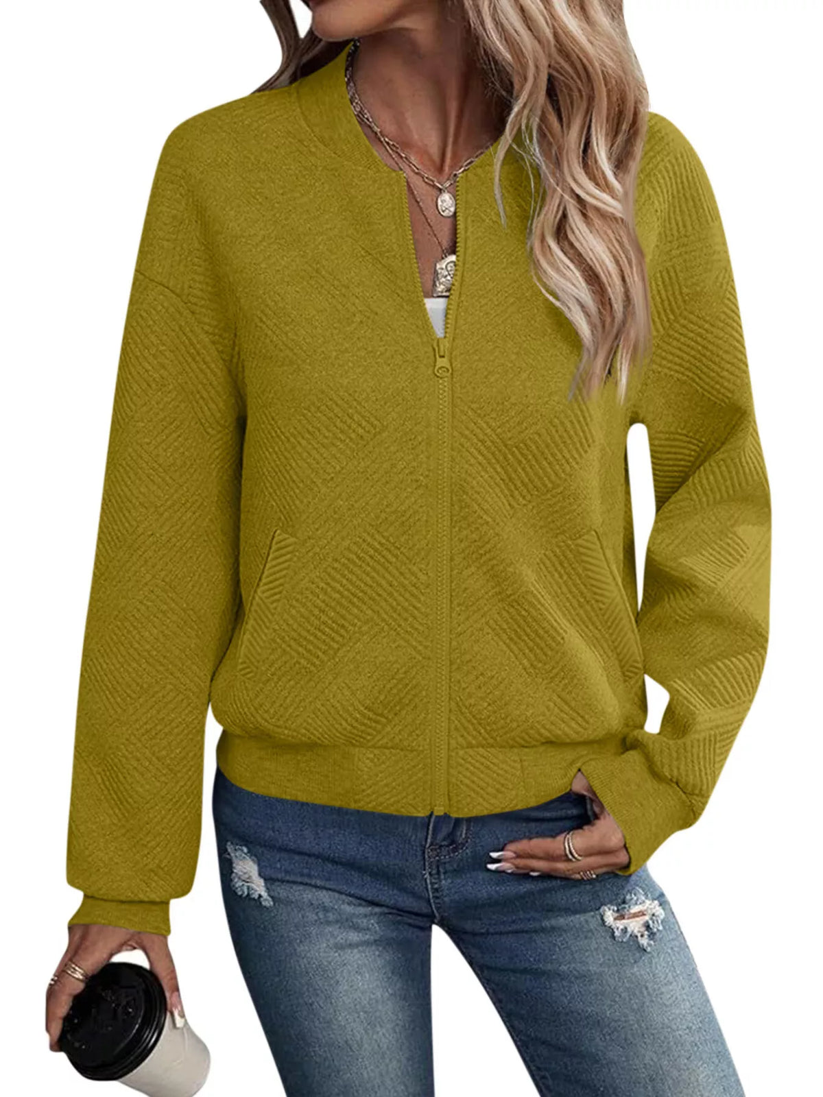 Mustard yellow textured knit zip-up jacket with pockets, front zipper, and long sleeves