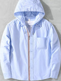 Light blue hooded button-up shacket with chest pocket and multicolor zipper trim