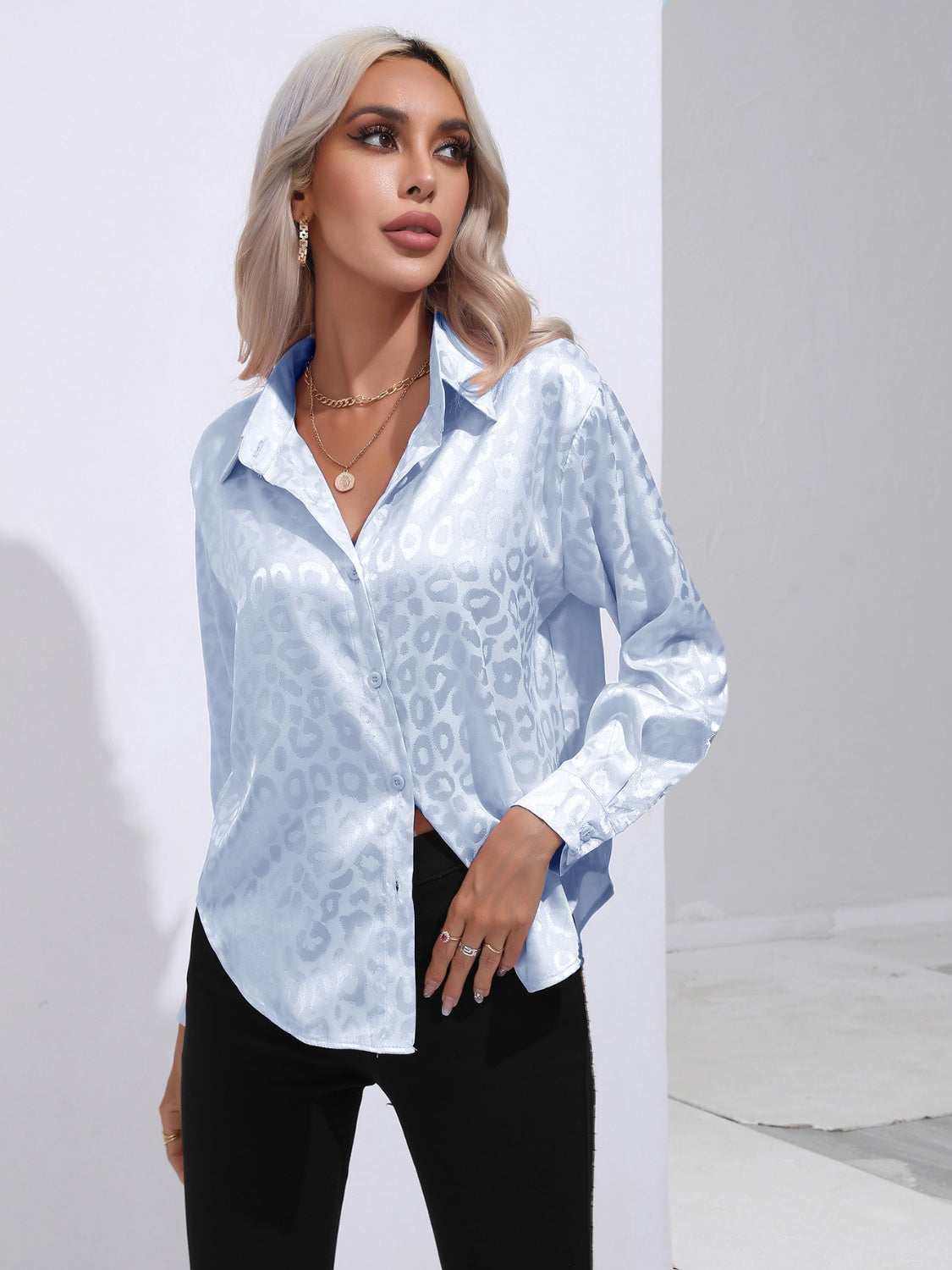 Light blue leopard-print collared button-up shirt with open collar, long sleeves