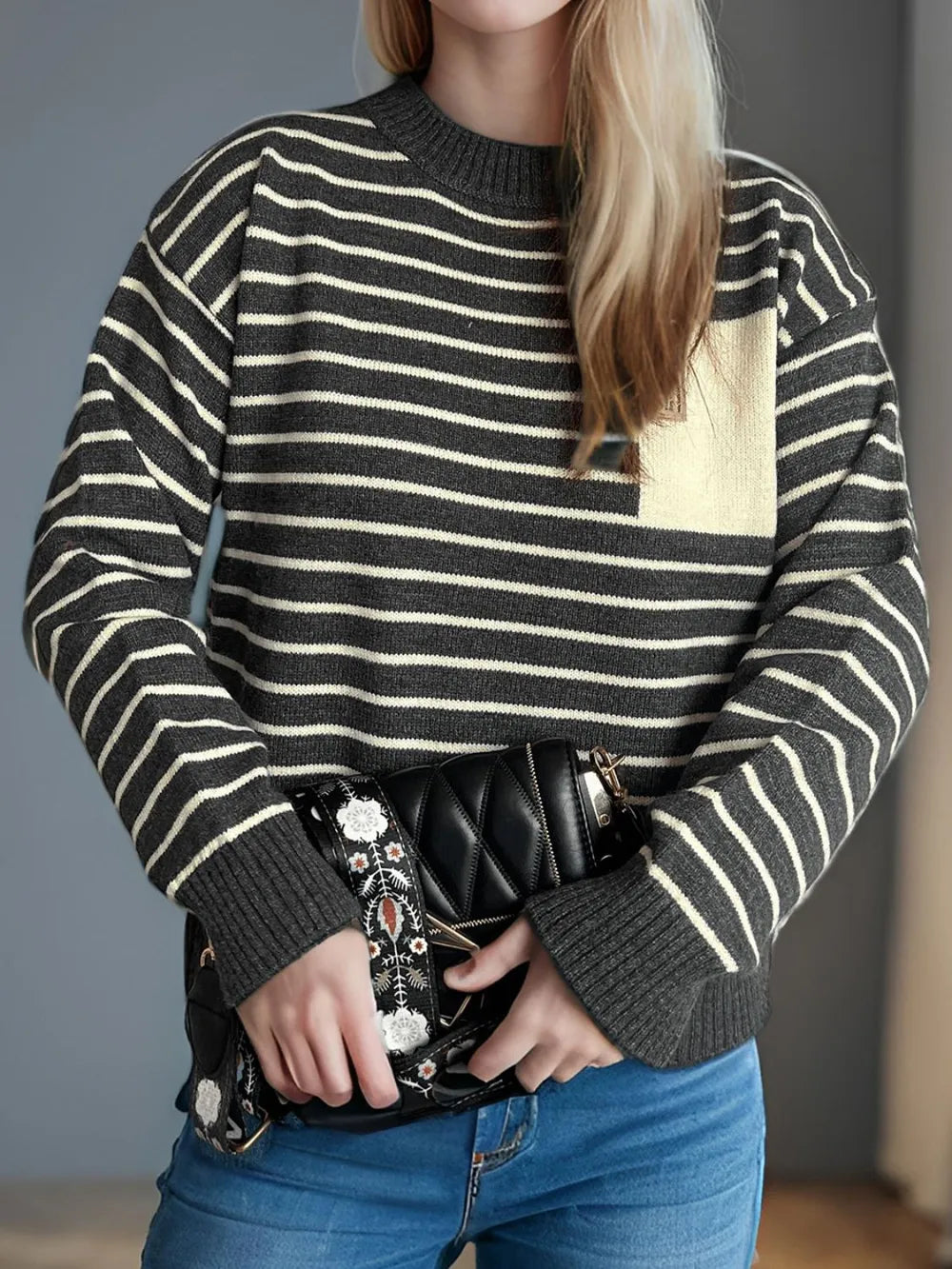 Striped mock neck long-sleeve sweater with dark body and cream horizontal stripes