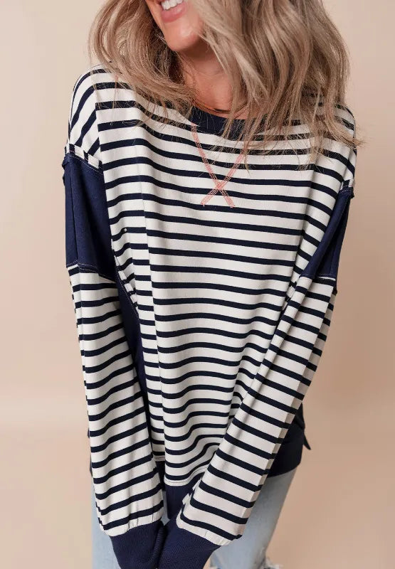 Striped long sleeve sweatshirt with exposed seam, navy and white stripes with pink cross stitch