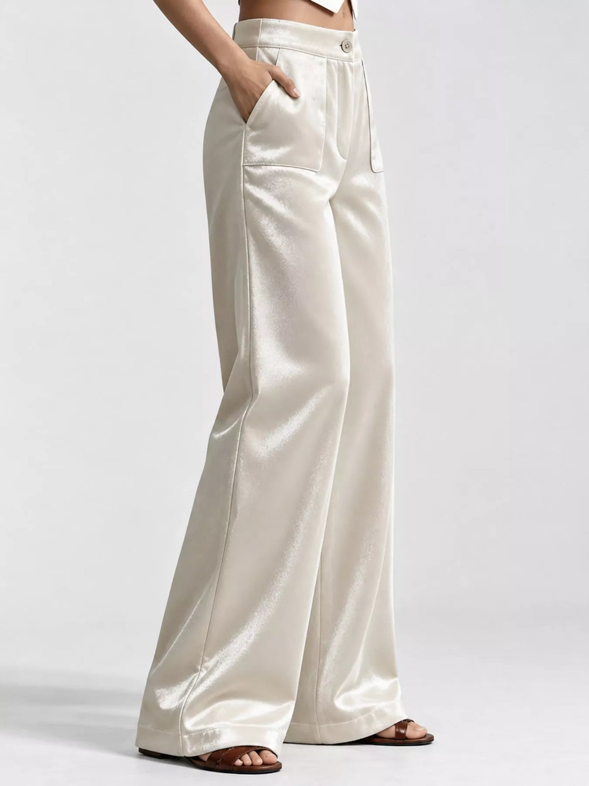 Off-white wide-leg velvet pants, high-waisted with side pockets and button closure