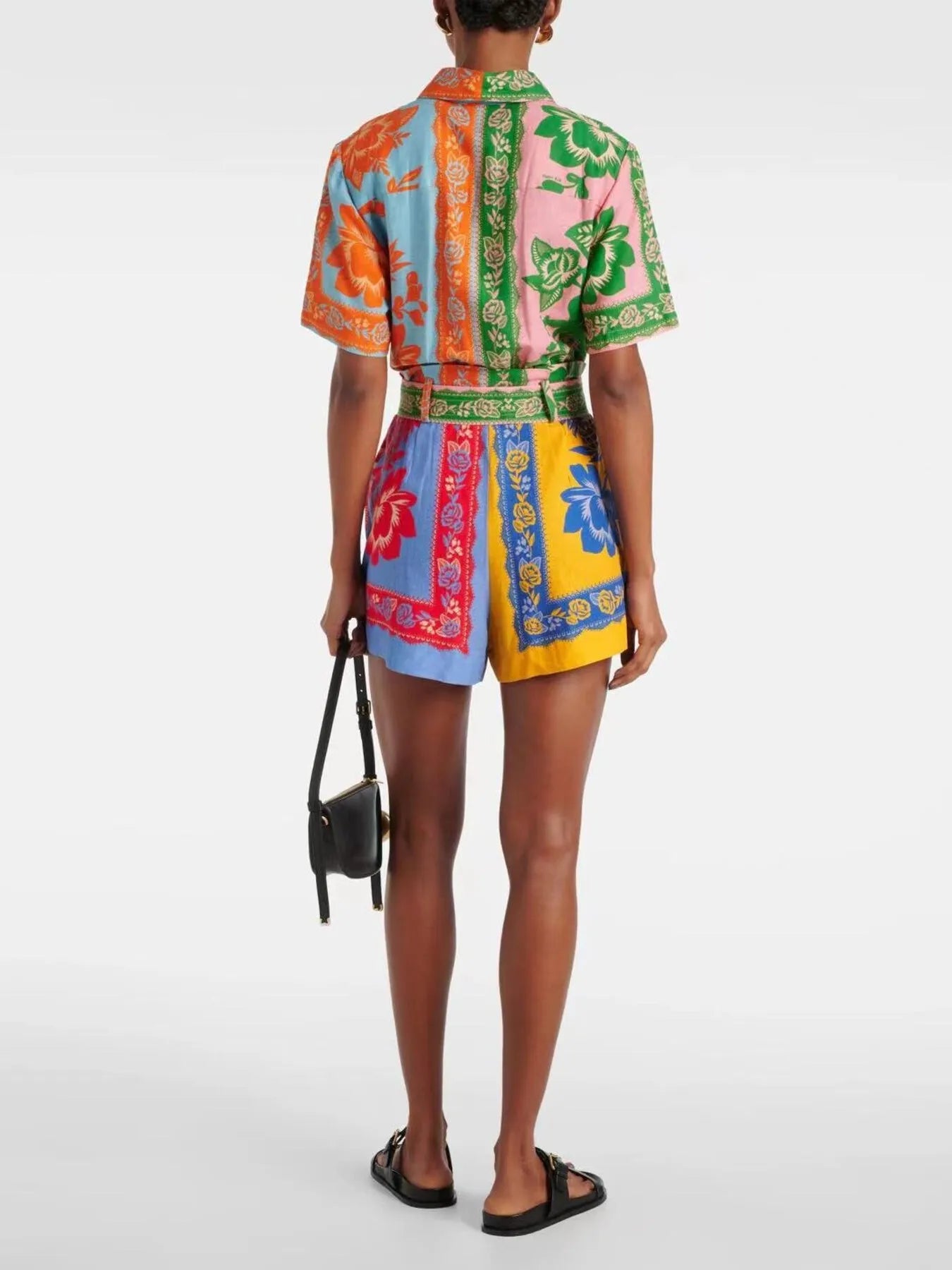 Multicolor printed romper from back view with tie waist and short sleeves