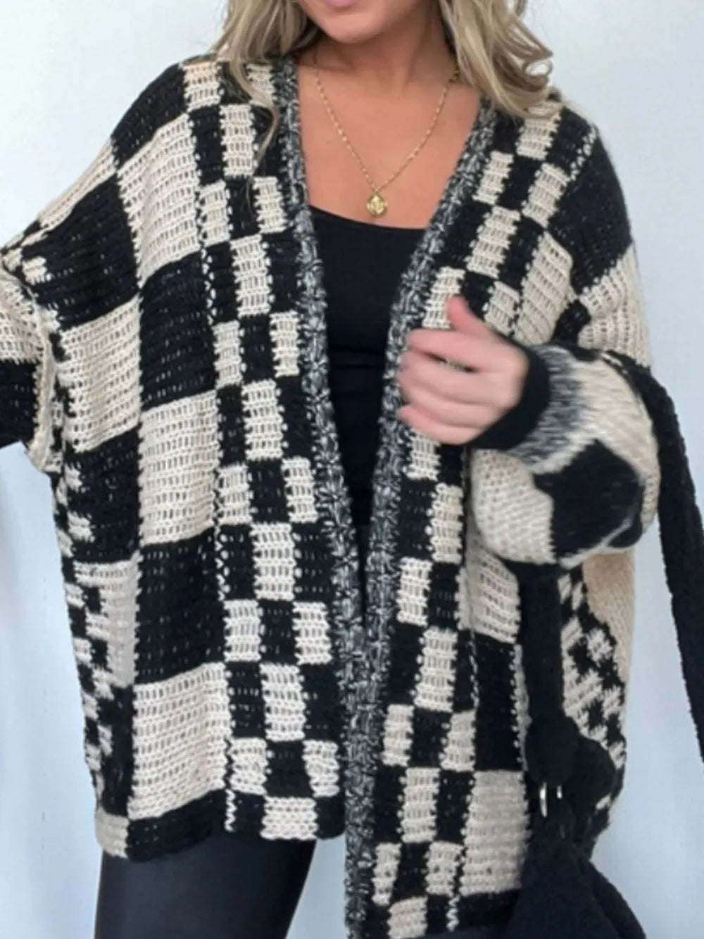 Plaid open-front cardigan, black-and-cream checker knit with long sleeves