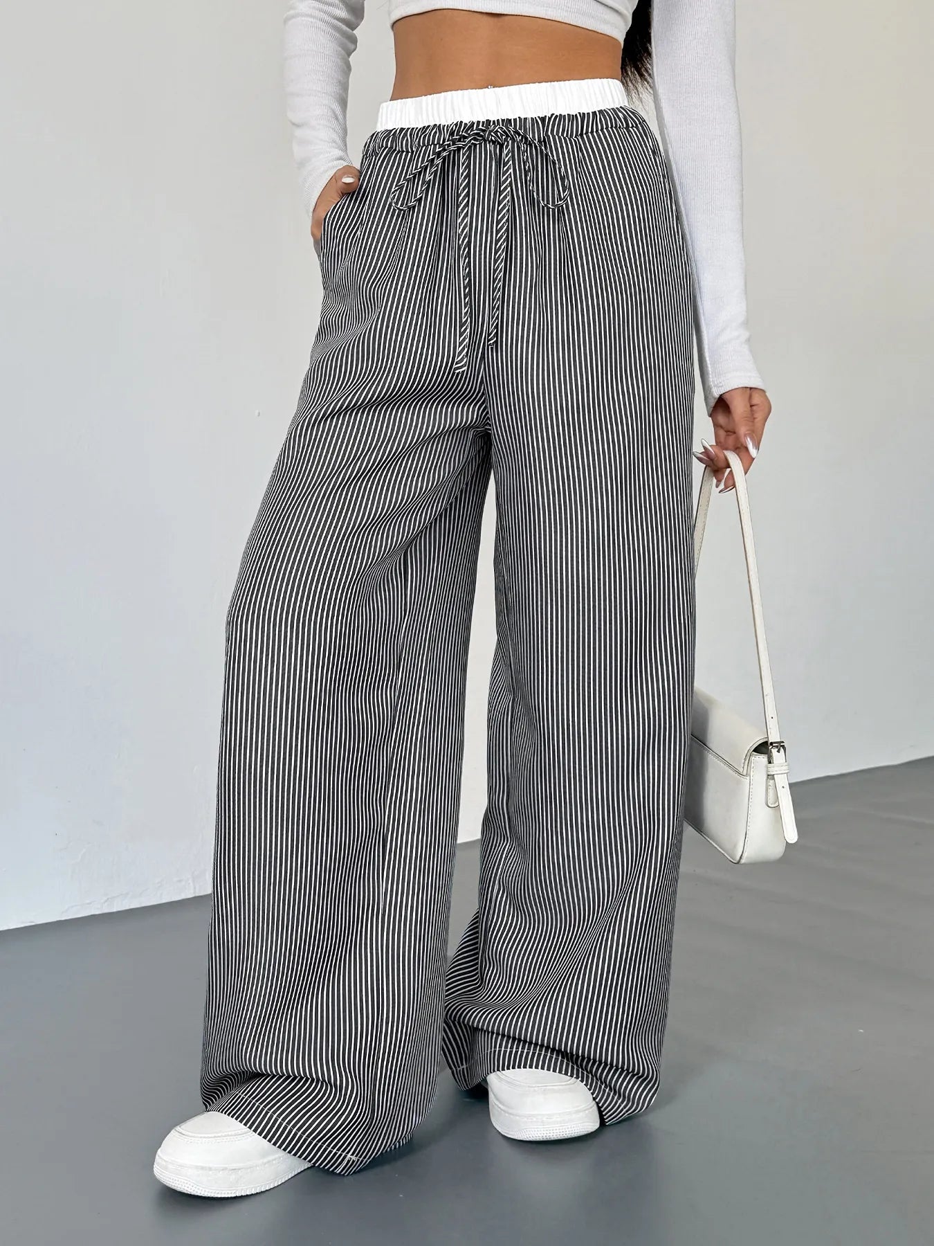 Striped wide-leg drawstring pants with elastic waistband and gathered waist, black and white stripes