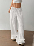 White wide-leg casual pants with elastic waistband and drawstring, full-length view.
