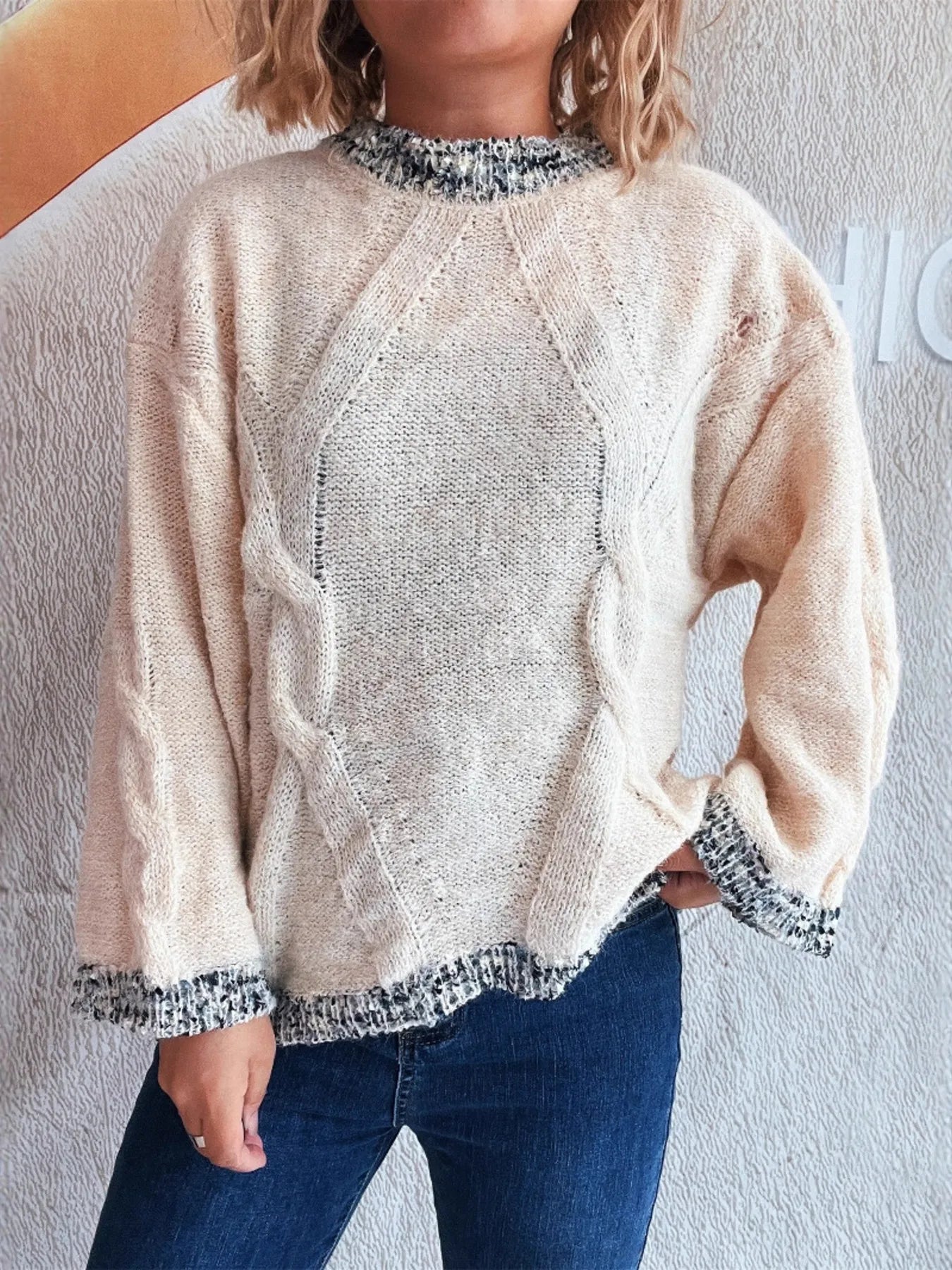 Apricot round-neck sweater with contrast trim cuffs and bottom hem