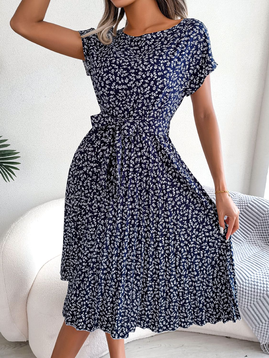 Ditsy floral pleated belted dress in navy blue with tie waist and pleated skirt