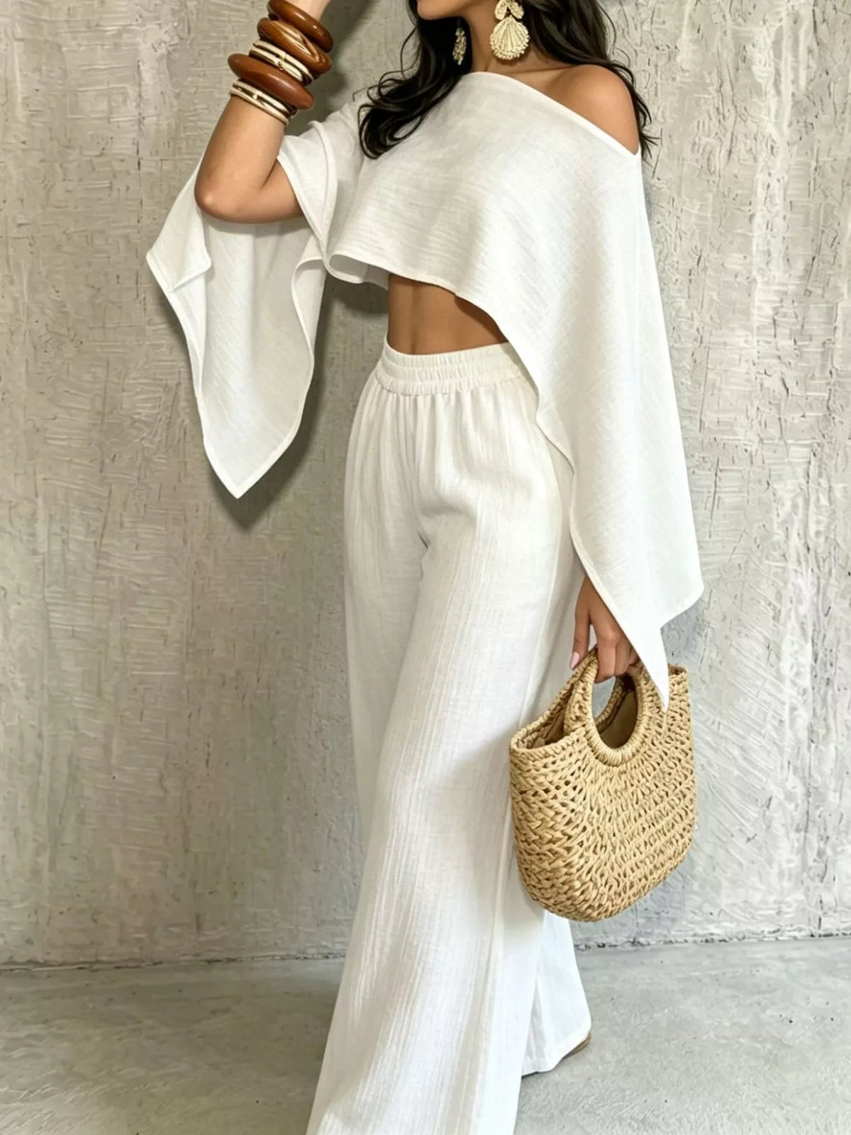 White boat-neck crop top and wide-leg pants set, draped sleeves