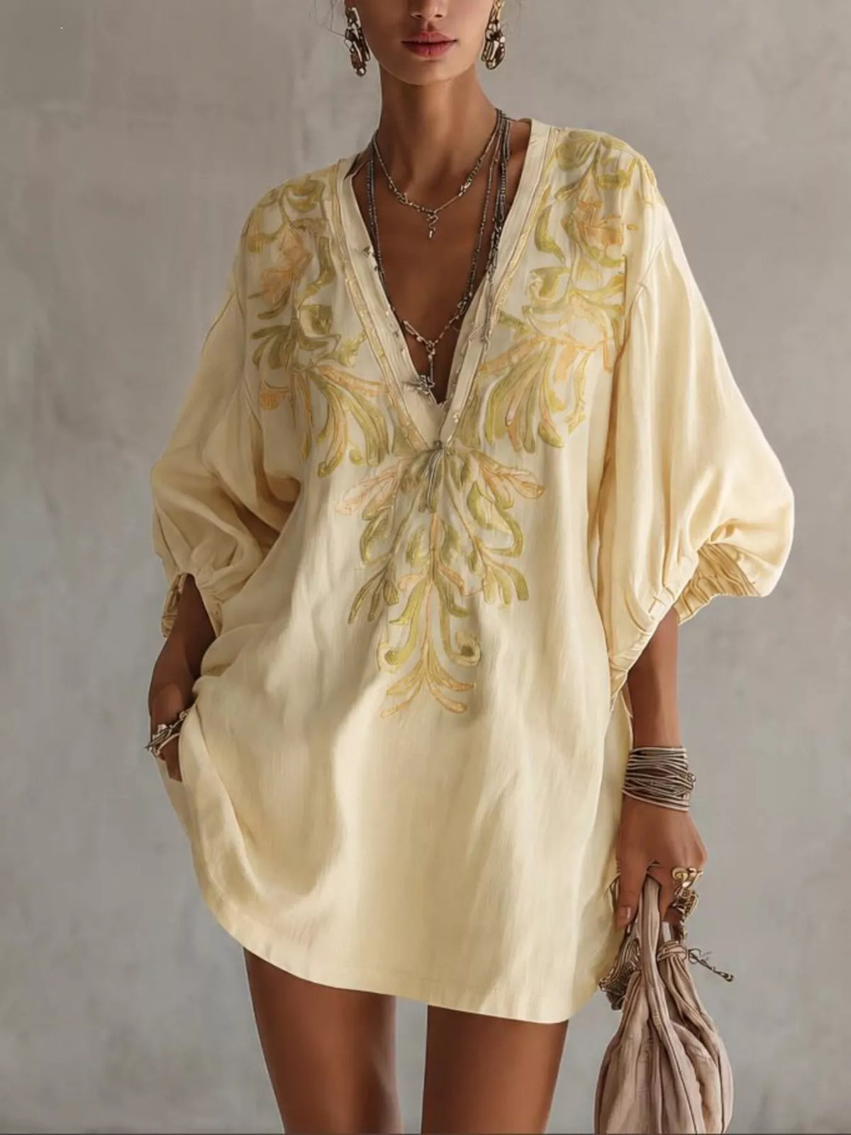 Embroidered v-neck mini dress, pastel yellow with floral embroidery and short puff sleeves