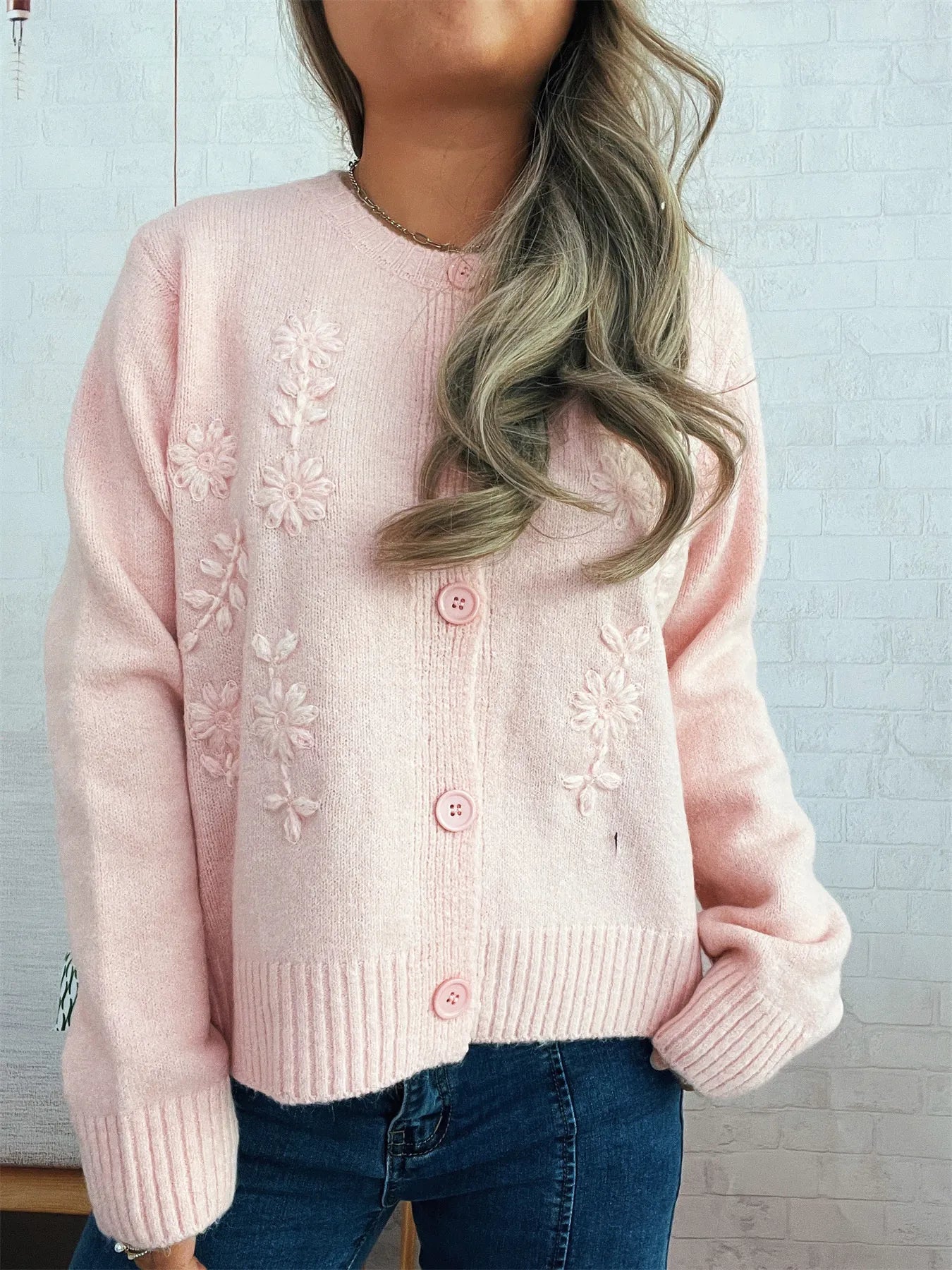 Pink cardigan with floral embroidery, button front, ribbed cuffs and hem
