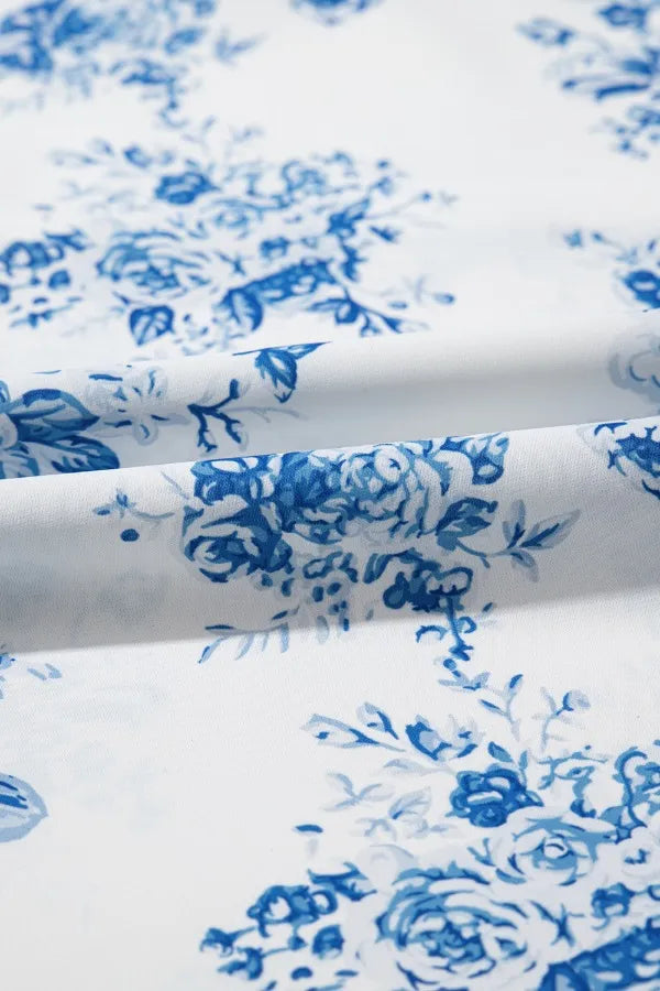 White fabric with light blue floral print