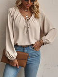 Apricot v-neck tie-front blouse with puffed long sleeves