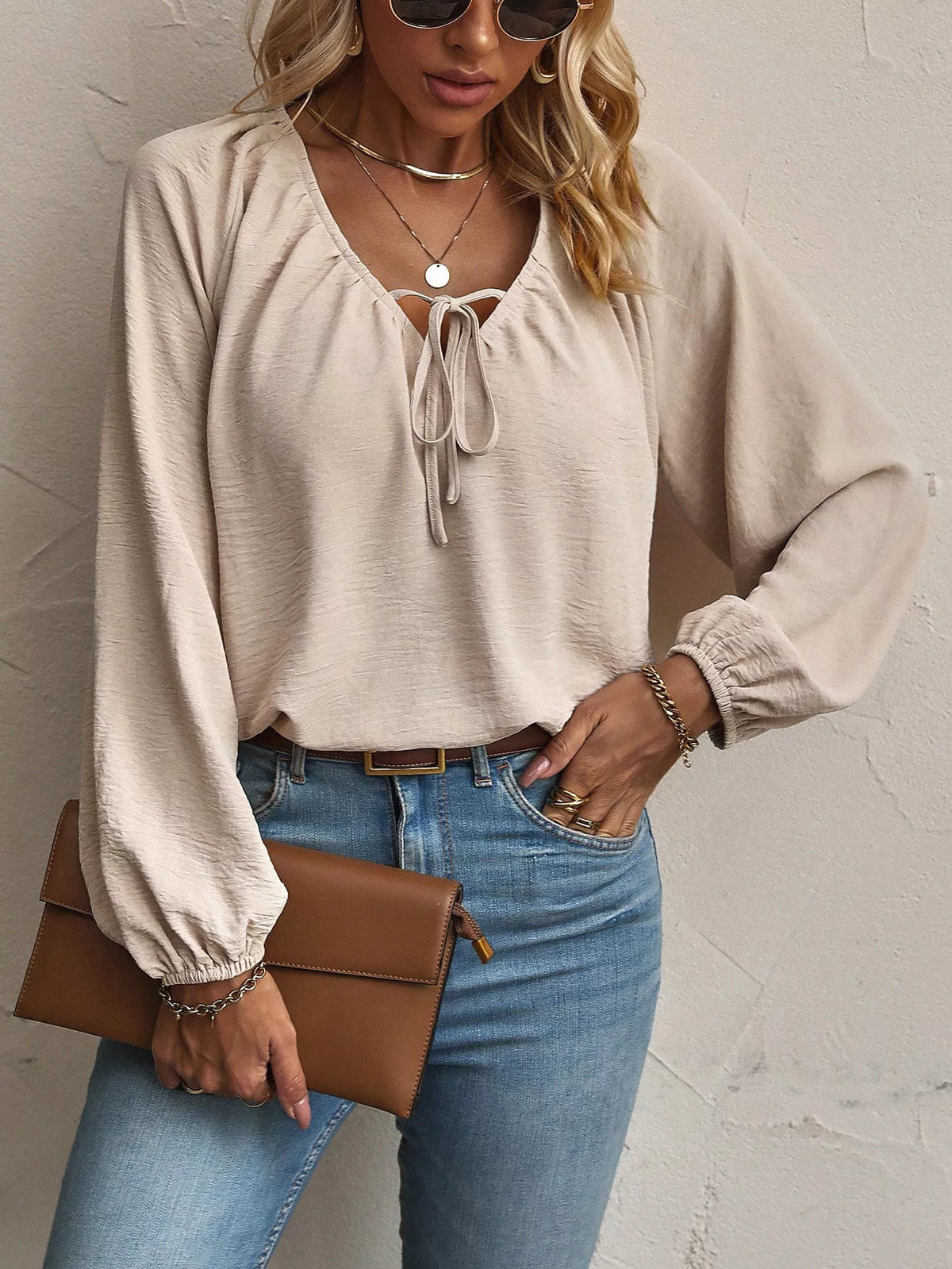Apricot v-neck tie-front blouse with puffed long sleeves