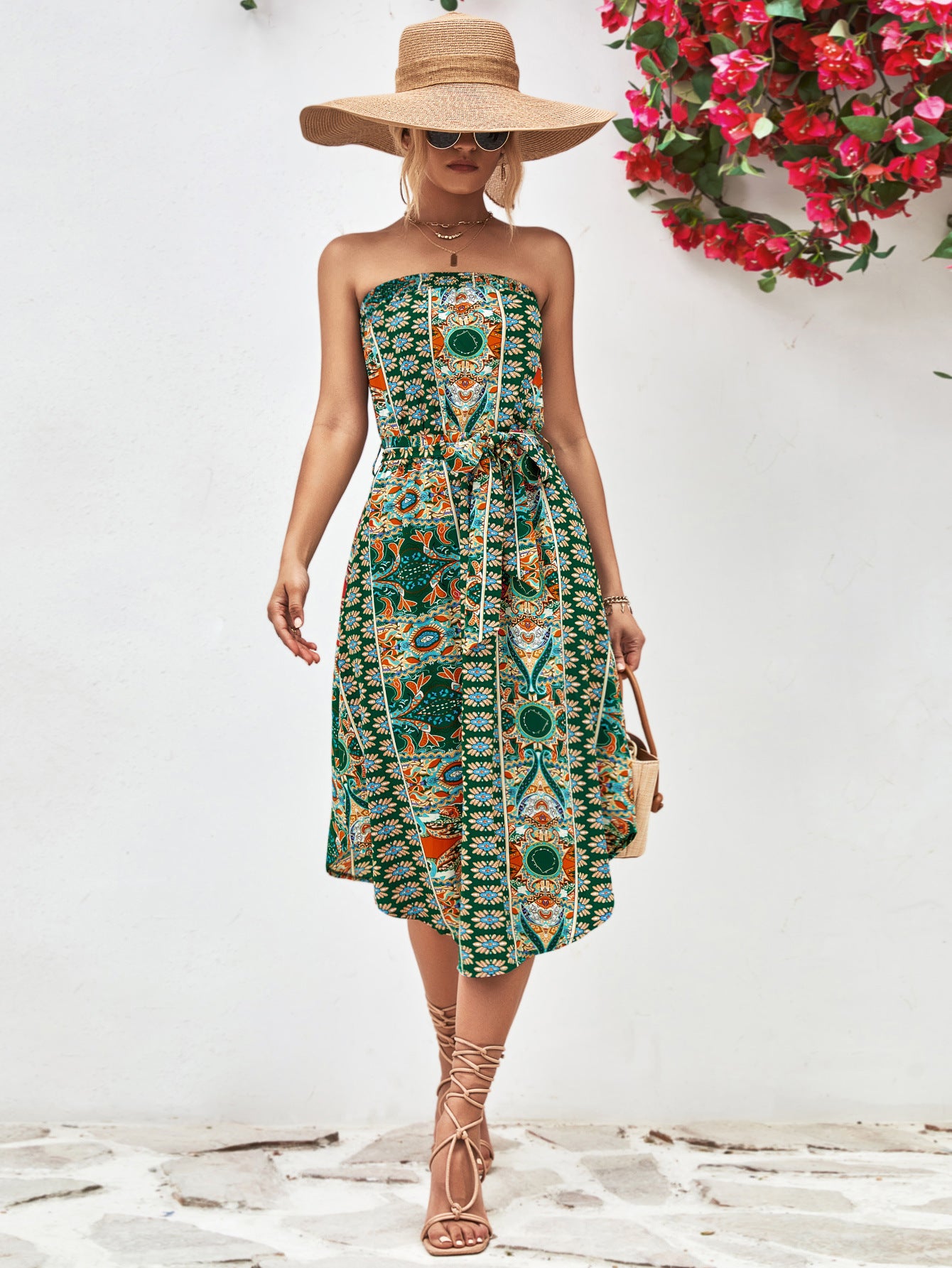 Green strapless tie-belt dress with colorful ornamental print, gathered waist, midi length