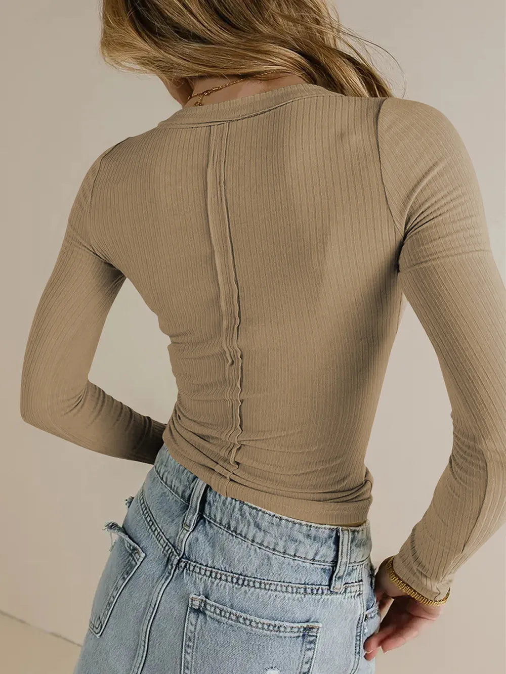 Tan v-neck long-sleeve t-shirt, back view with center seam and ribbed texture
