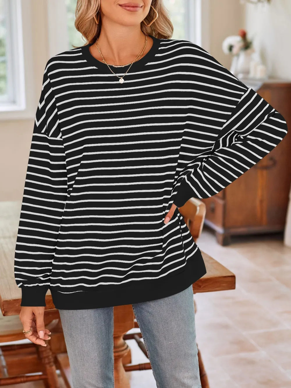 Black striped crew-neck long-sleeve sweatshirt with white horizontal stripes
