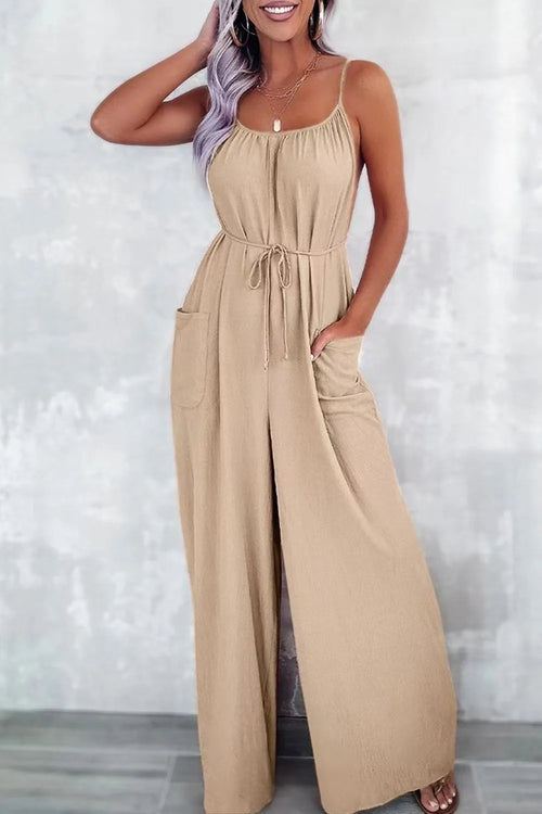 Tan spaghetti-strap wide-leg jumpsuit with drawstring waist and side pockets