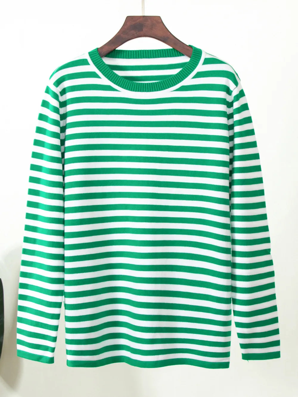 Striped long-sleeve sweater in bright green and white with crew neck.