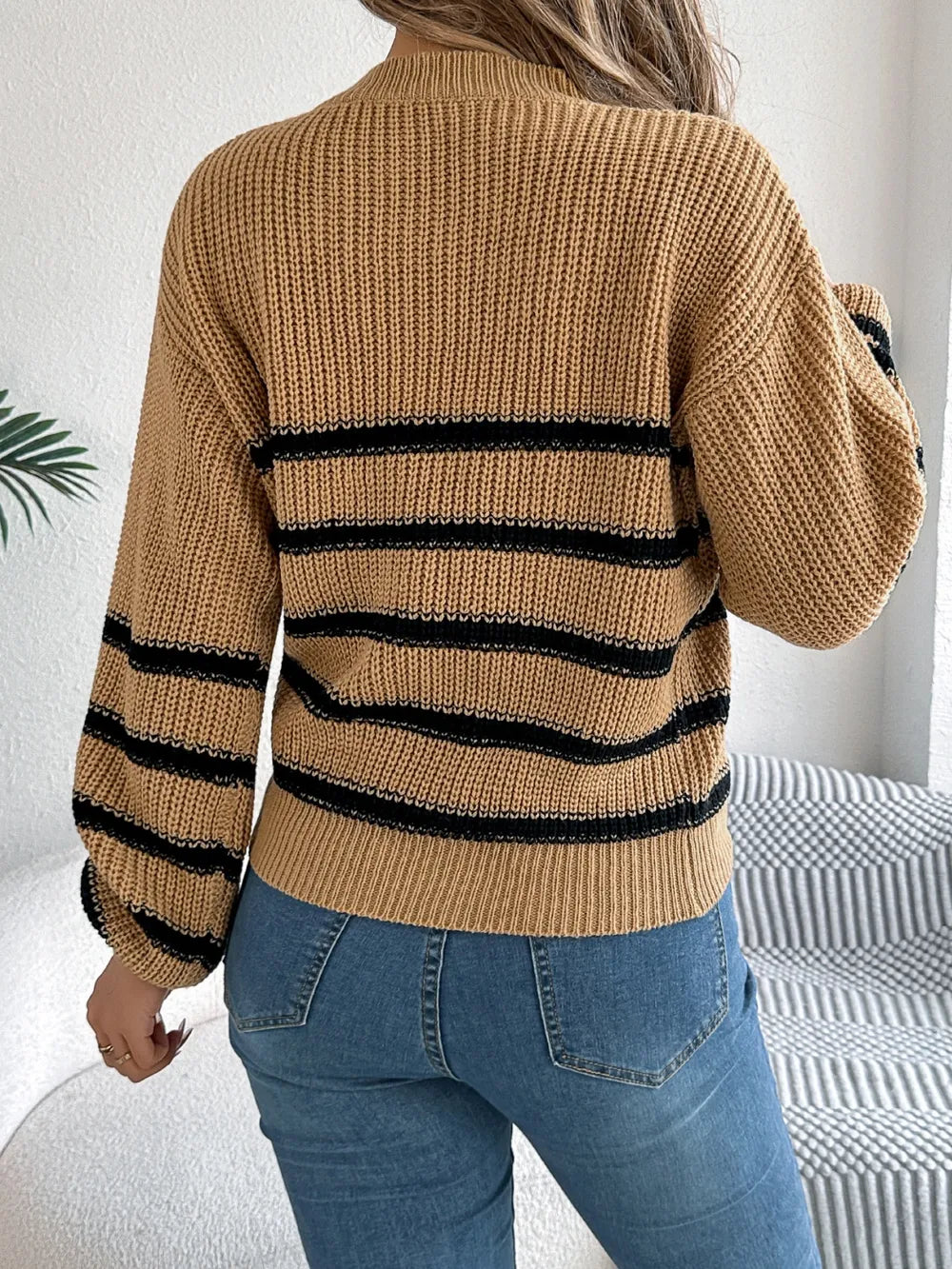 Caramel striped knit sweater, back view with striped bands and long sleeves