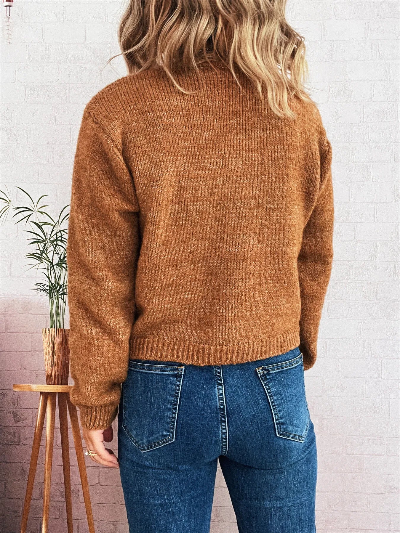 Brown ribbed hem cardigan sweater with crew neckline and long sleeves