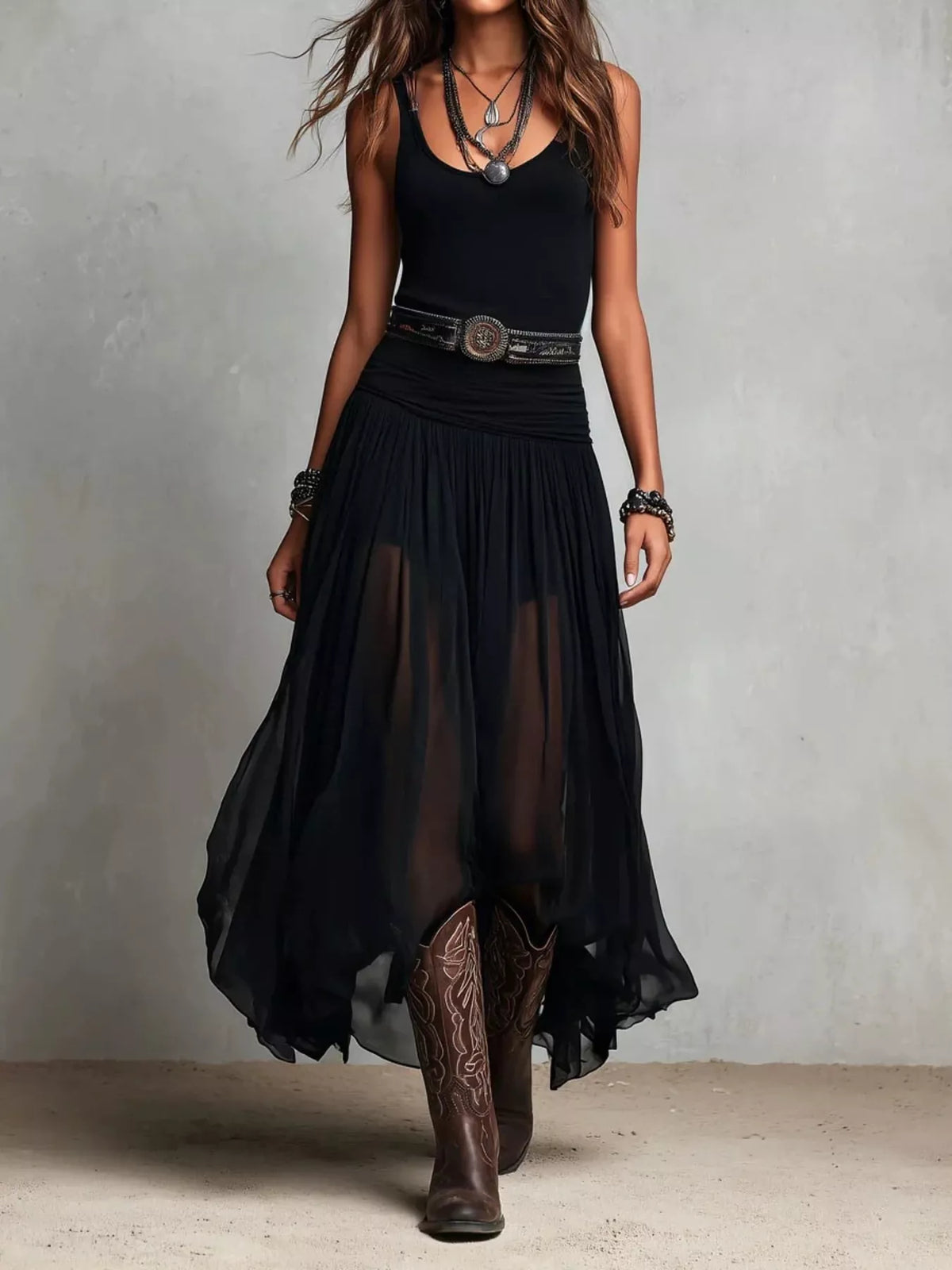 Black sleeveless scoop-neck maxi dress with tiered chiffon-like skirt and western belt
